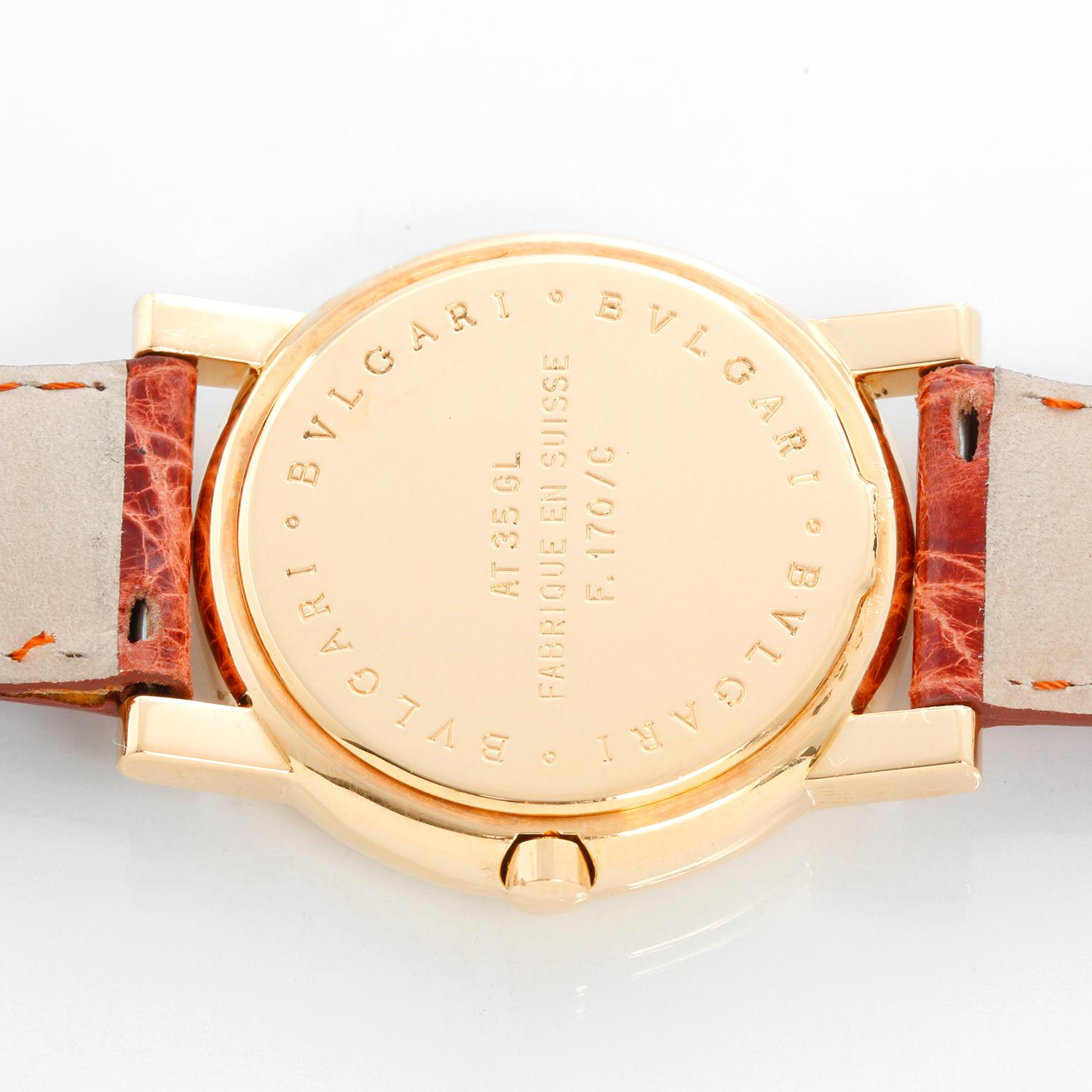 Bulgari Anfiteatro 18K Yellow Gold Watch AT35GLD - Quartz. 18K Yellow gold ( 35 mm ). White dial with raised yellow gold stick hour markers with date at 3 o'clock. Brown leather strap with tang buckle. Pre-owned with custom box .