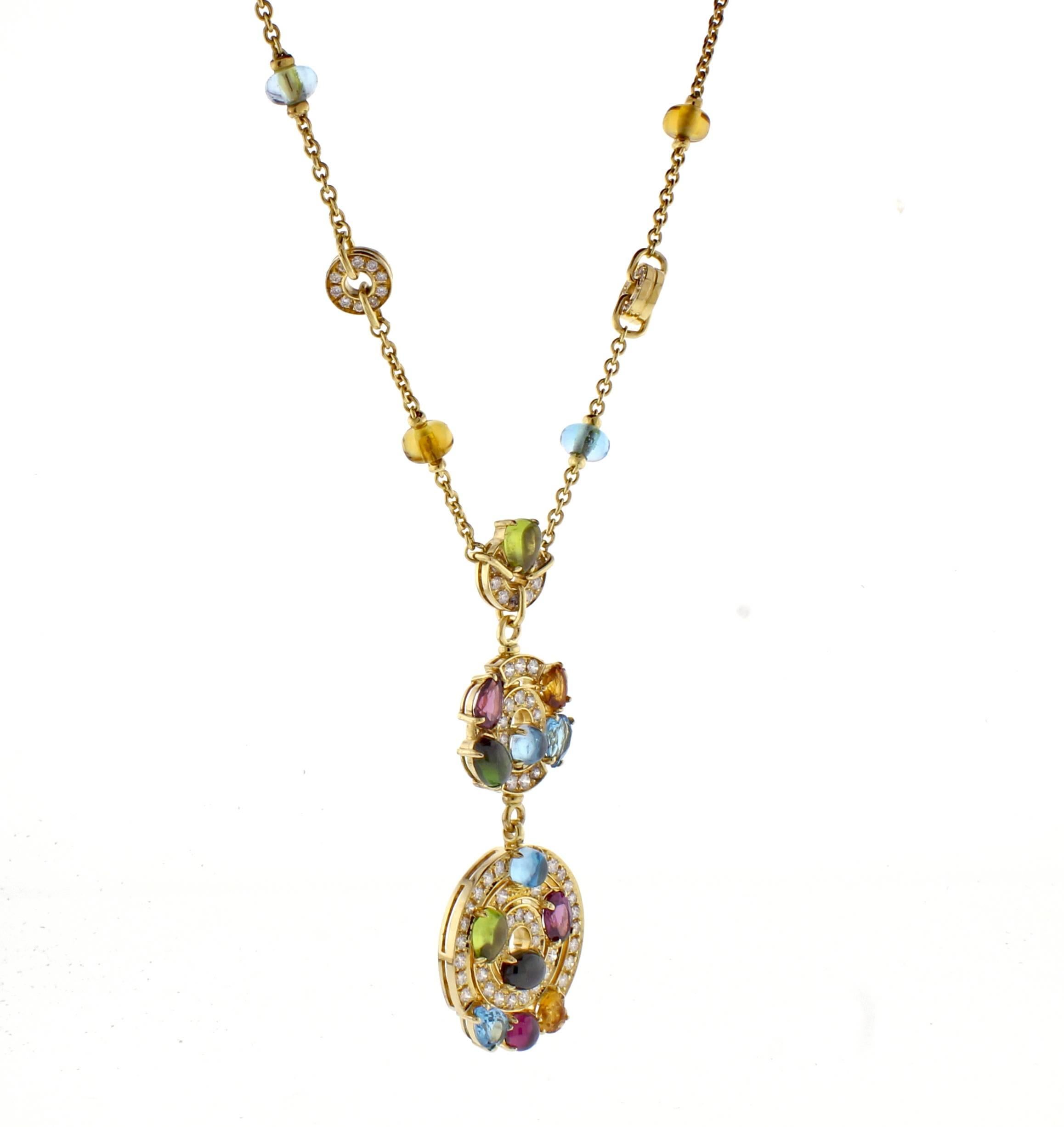 Bulgari  Astral gold necklace with pendant from Concentrica collection, 116 diamonds weigh approximately 2.75 carats. Highlighted with  blue topaz, tourmaline, citrine and peridot.  The larger circle measure 1 inch in diameter with the smaller