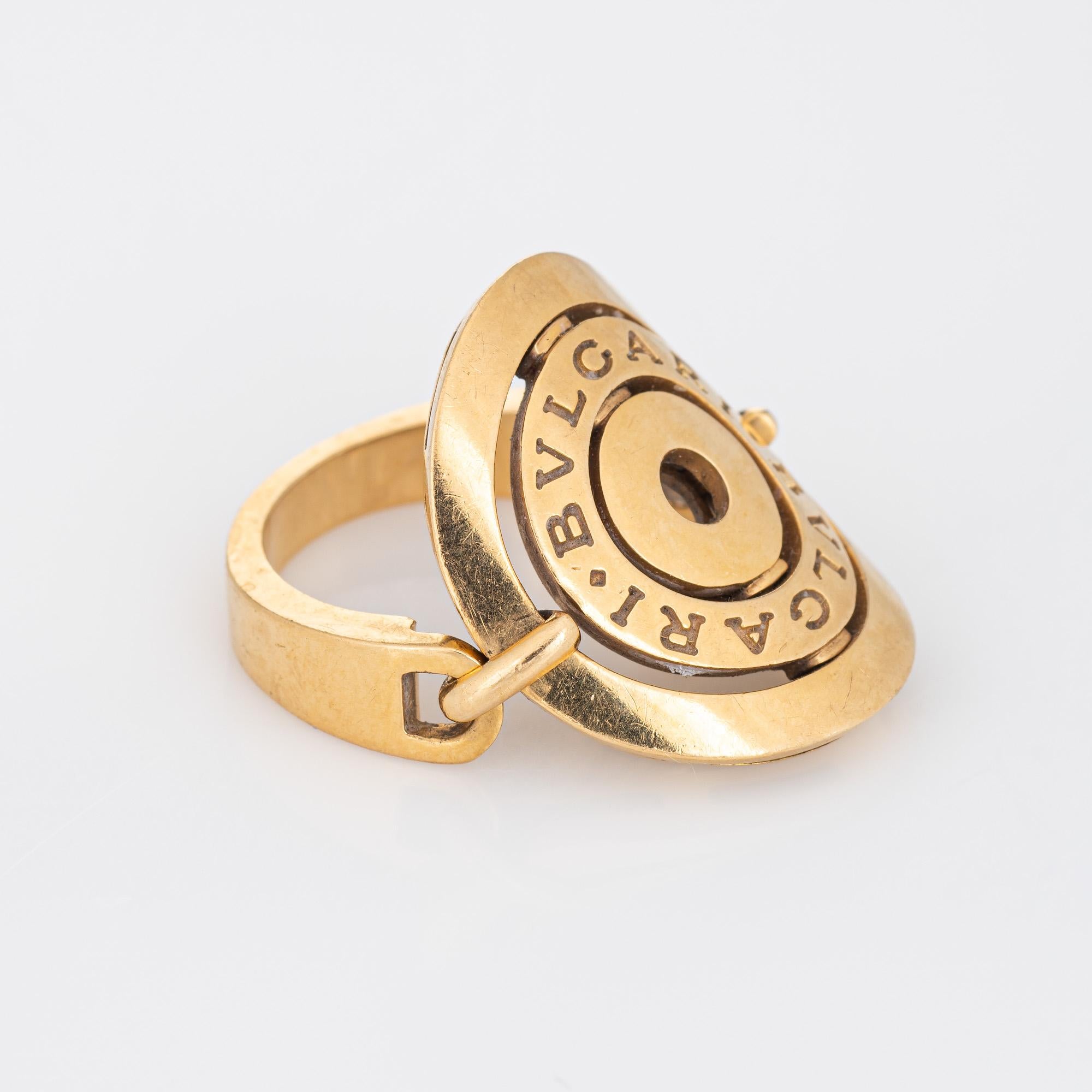 Pre-owned Bulgari 'Astrale Cerchi' ring crafted in 18k yellow gold.  

The classic Bulgari ring features a hinged circular mount, with a curved saddle to meld to the shape of your finger. The ring sits flat on the finger and is great worn alone or