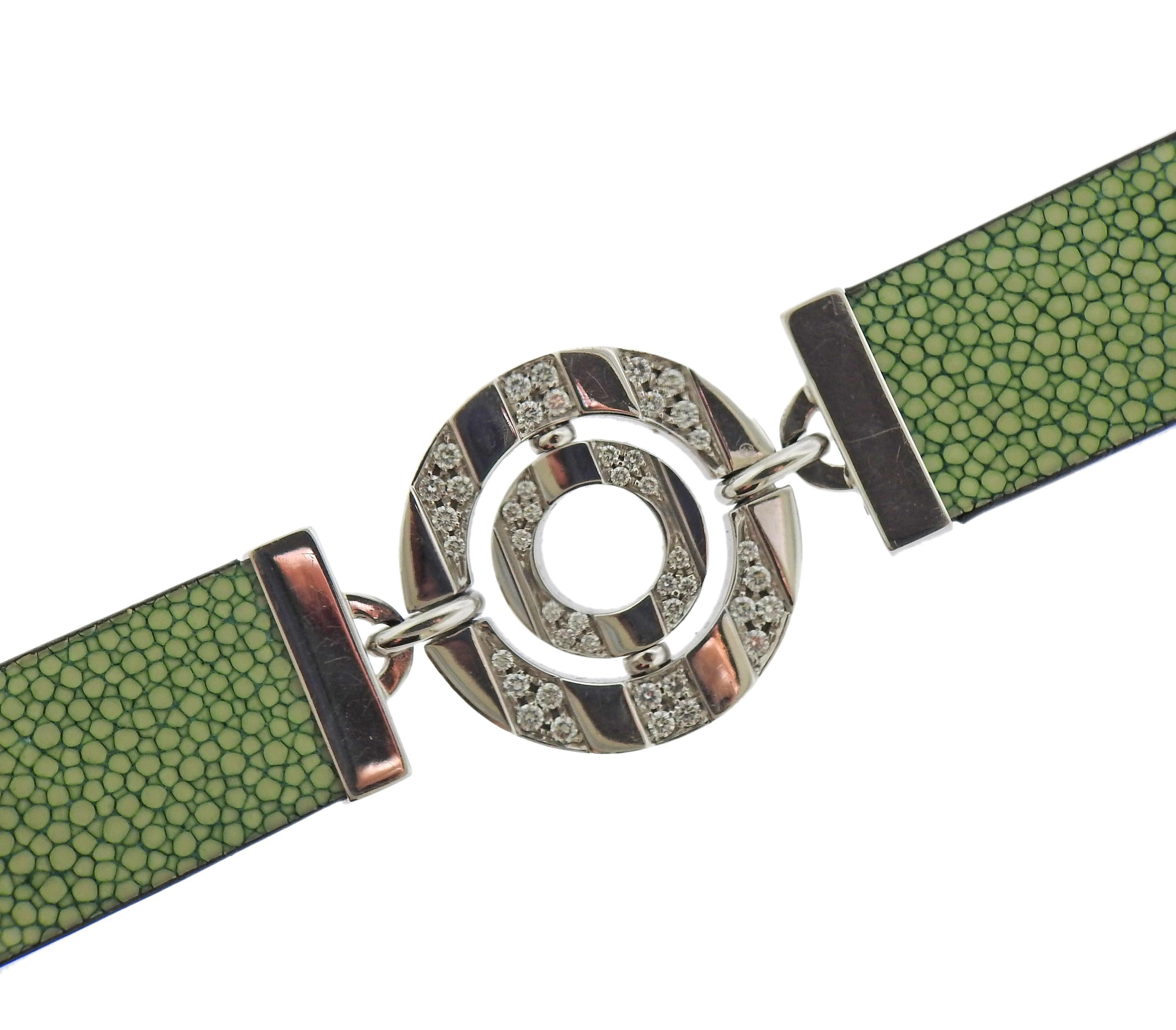 Iconic 18k white gold Bvlgari bracelet from Astrale collection, featuring approx. 0.74ctw in diamonds and green ostrich leather bracelet. Maximum length with the extender - 8