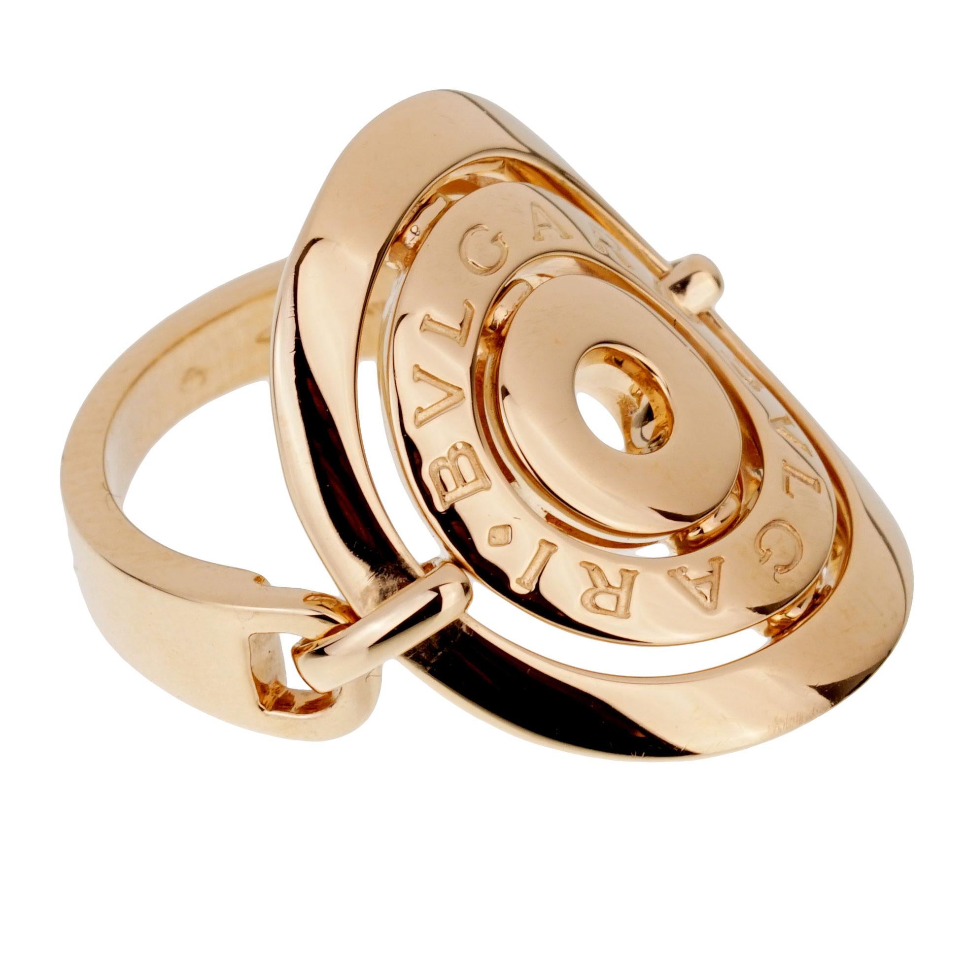 A fabulous Bulgari cocktail ring circa early 2000's featuring a 3 circular discs one engraved with Bulgari Bulgari in 18k yellow gold. The ring measures a size 5 3/4 and can be resized