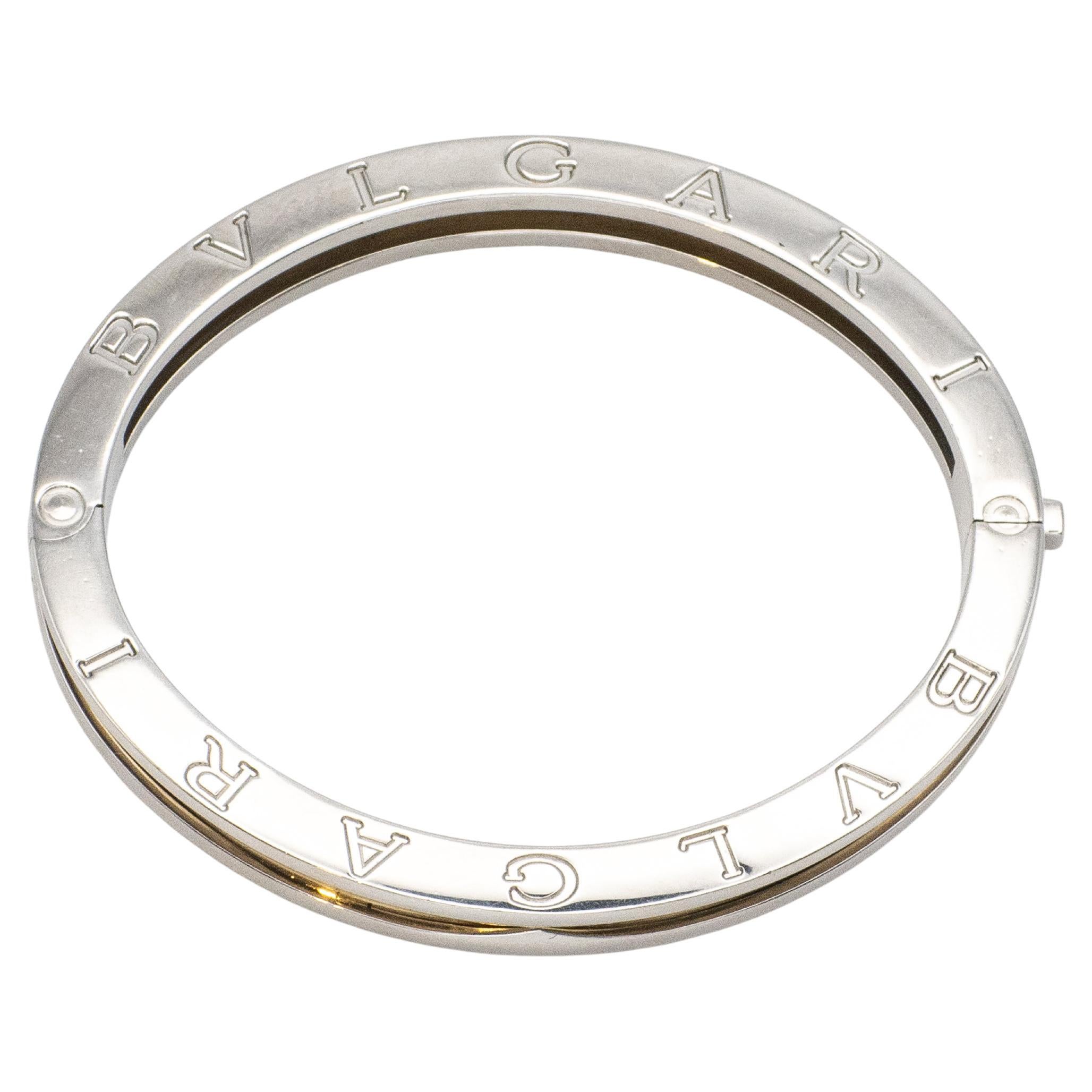 Preowned BULGARI 18k yellow gold and steel hinged bangle from the B. Zero 1 series. Oval shaped bangle with steel edges and 18k yellow gold in between
BVLGARI is engraved on top & bottom sides

Fits wrists under 6.5