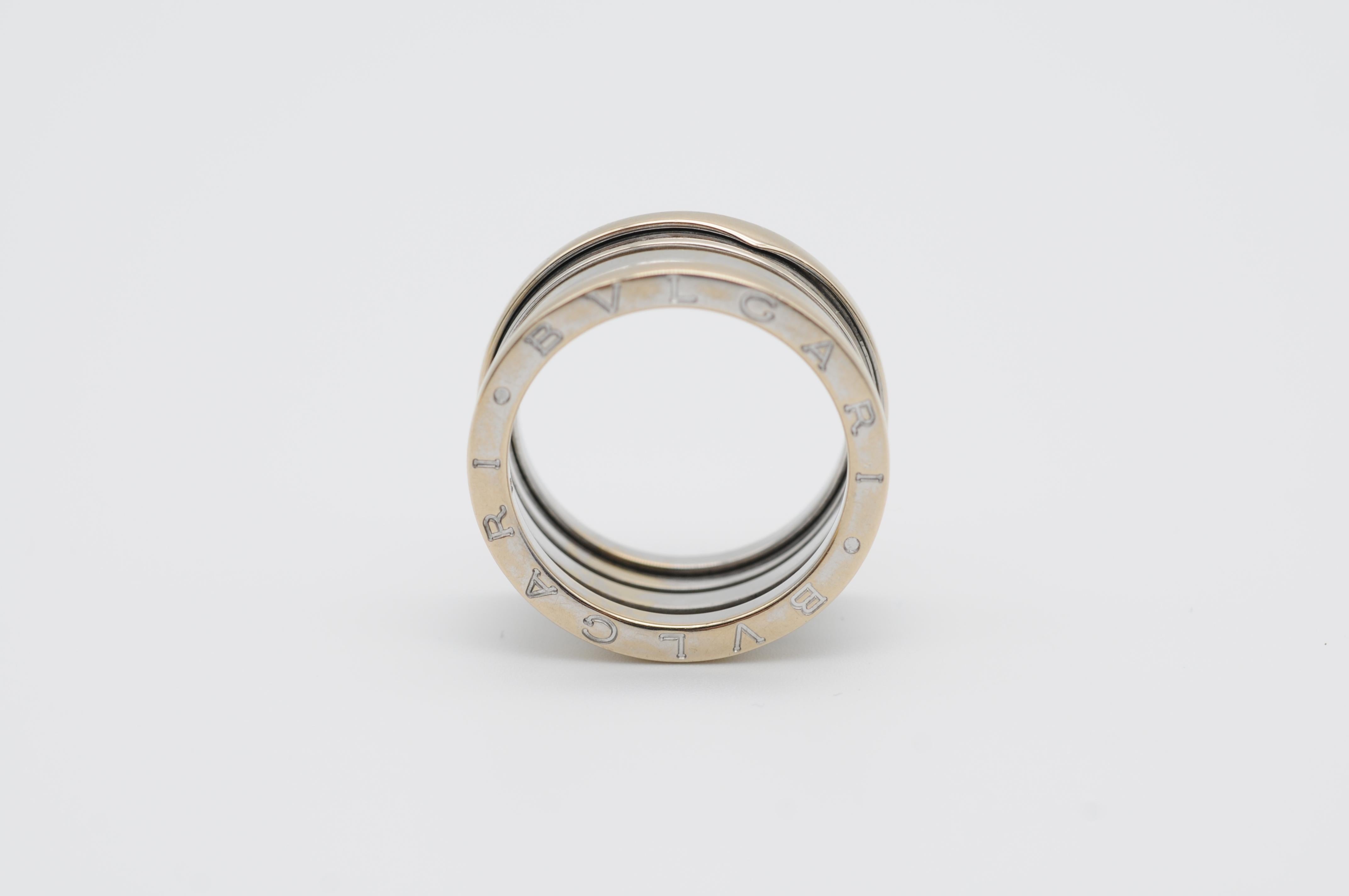 This stunning Bulgari B Zero Band Ring in 18K White Gold is a true masterpiece of luxury and elegance. The simple yet sophisticated design of this ring is a testament to the renowned craftsmanship of the Bulgari brand. The white gold band is smooth
