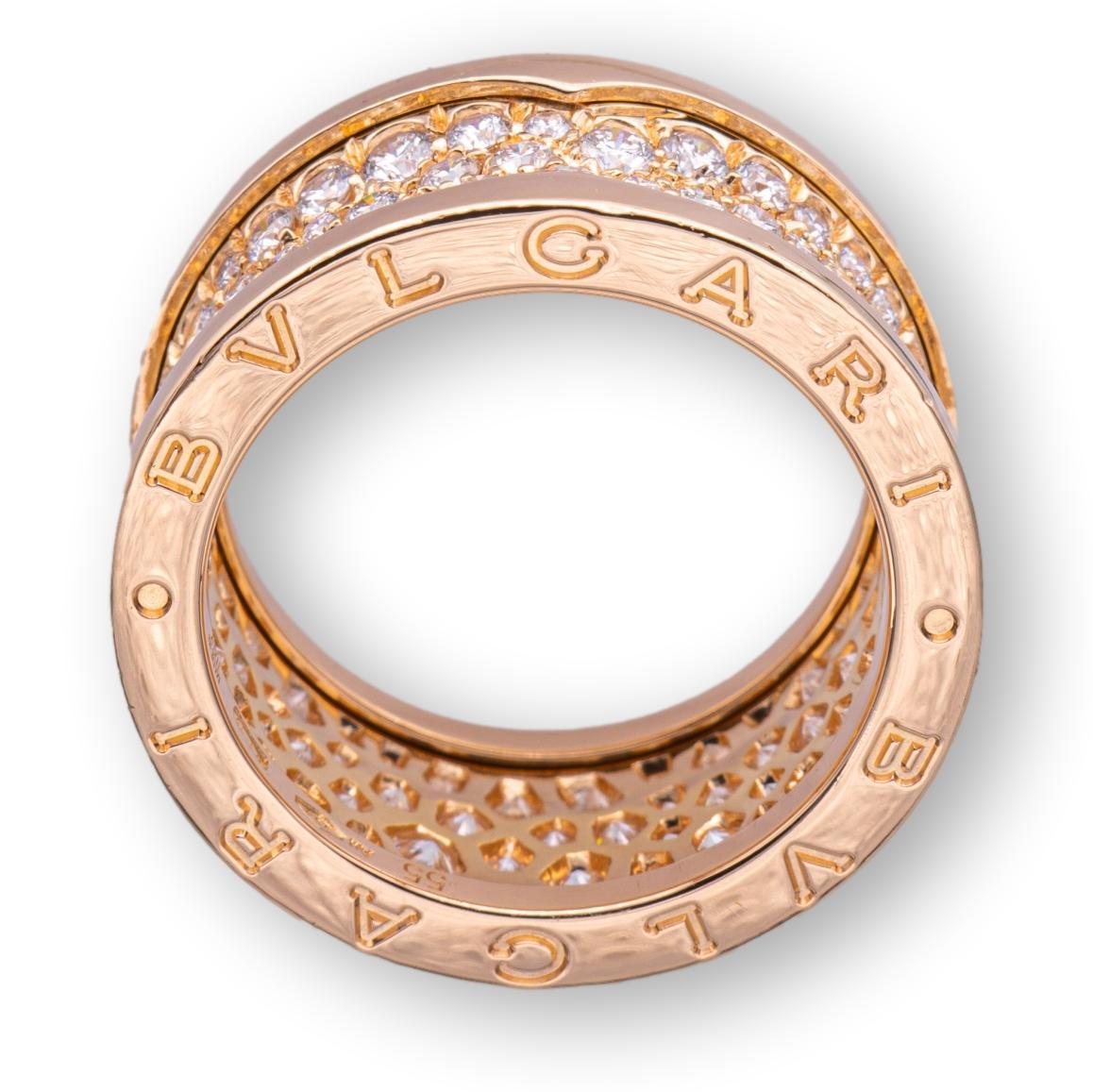 Bulgari band ring from the B-Zero1 collection finely crafted in 18 karat rose gold studded with 4 rows of bead set round brilliant cut diamonds going all the way around weighing 2.40 carats total weight approximately. Ring is fully hallmarked with