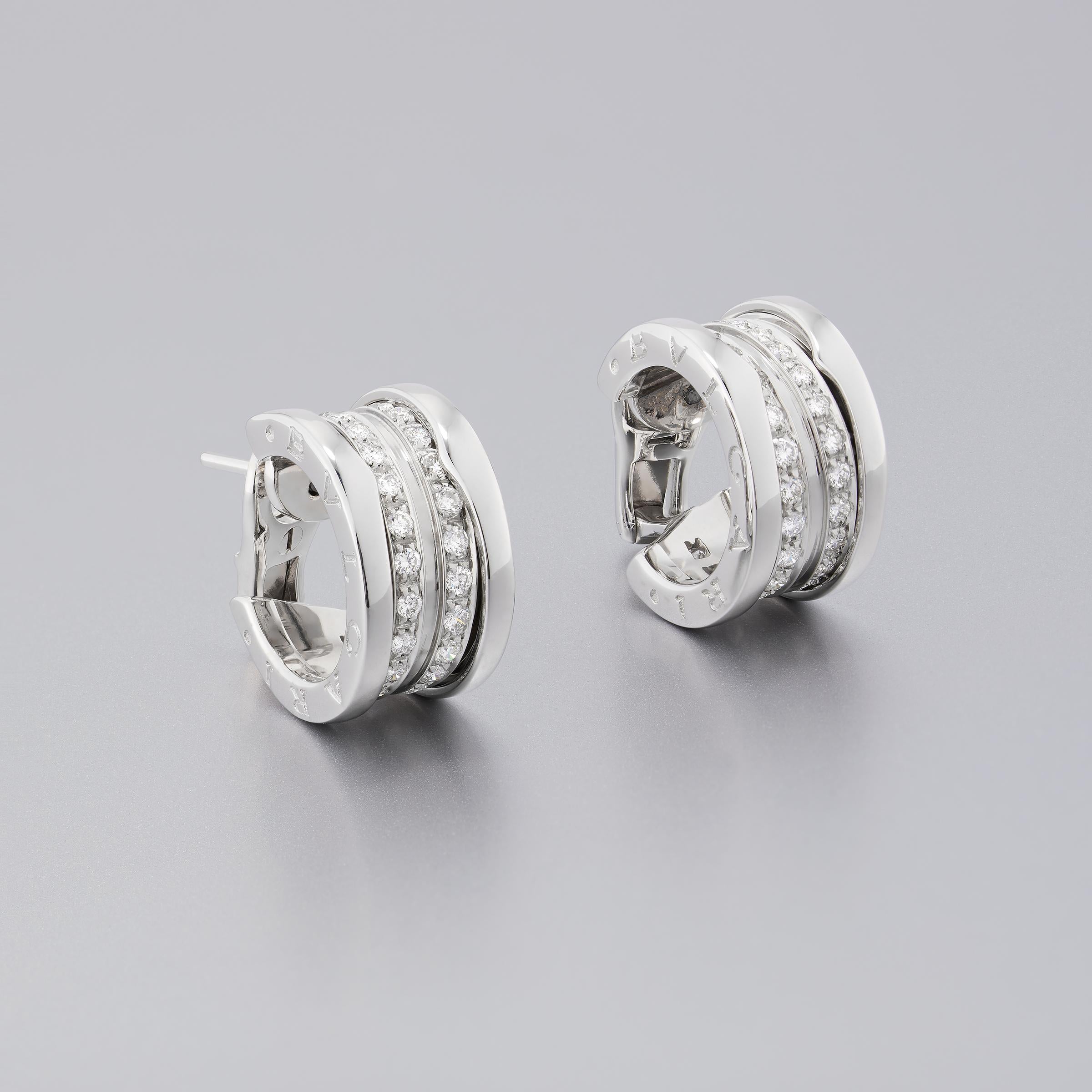 Stylish Bulgari diamond hoop / huggie earrings from iconic B.Zero1 collection that embodies Bulgari’s pioneering creative vision. The earrings sparkle with approximately 1 carat of fine white diamonds (E to F color, VVS to VS clarity) set in