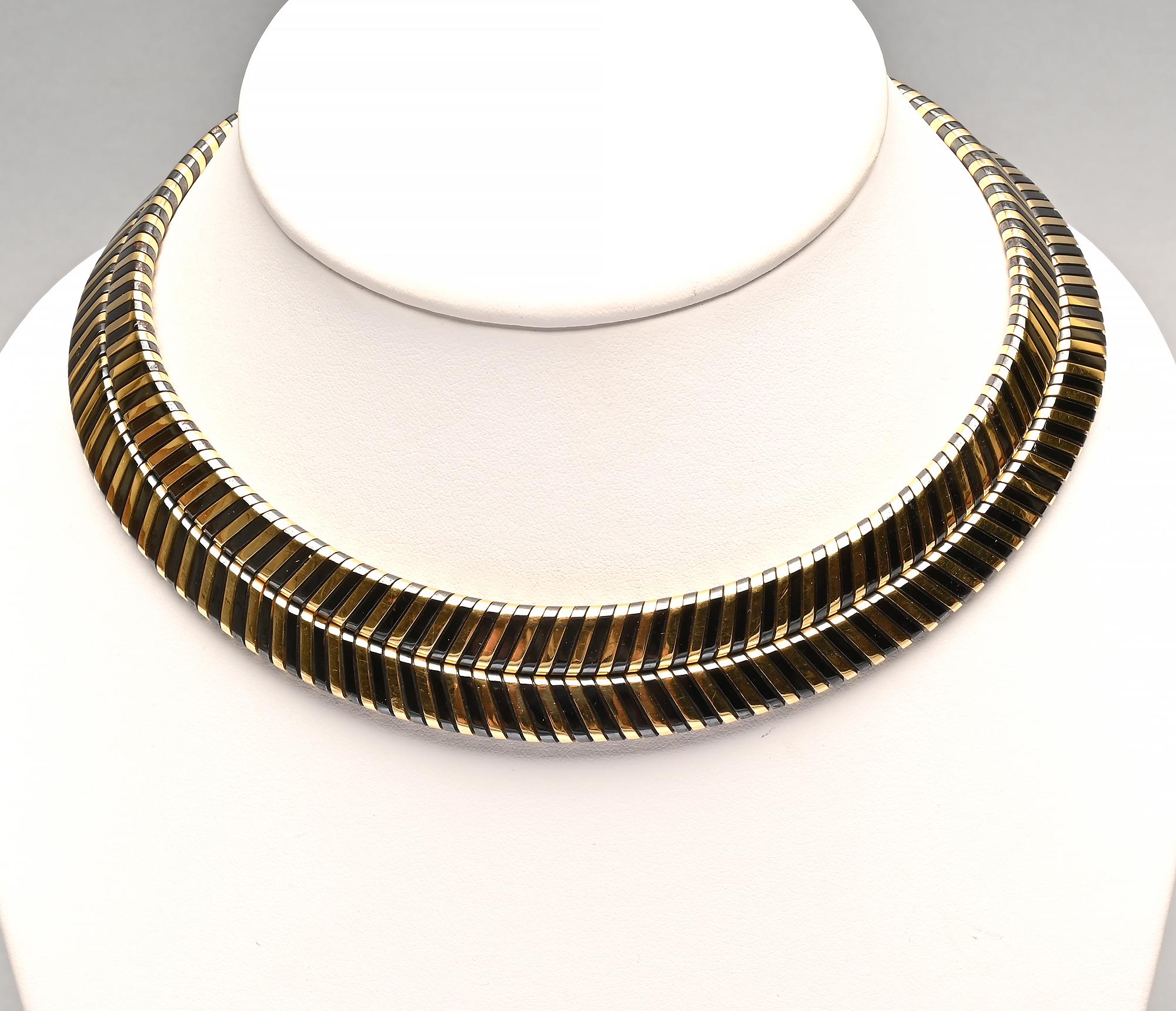 Stunning black and yellow 18 karat gold unusual choker necklace by Bulgari. The two rows form an unusual herringbone pattern.
They are 3/4