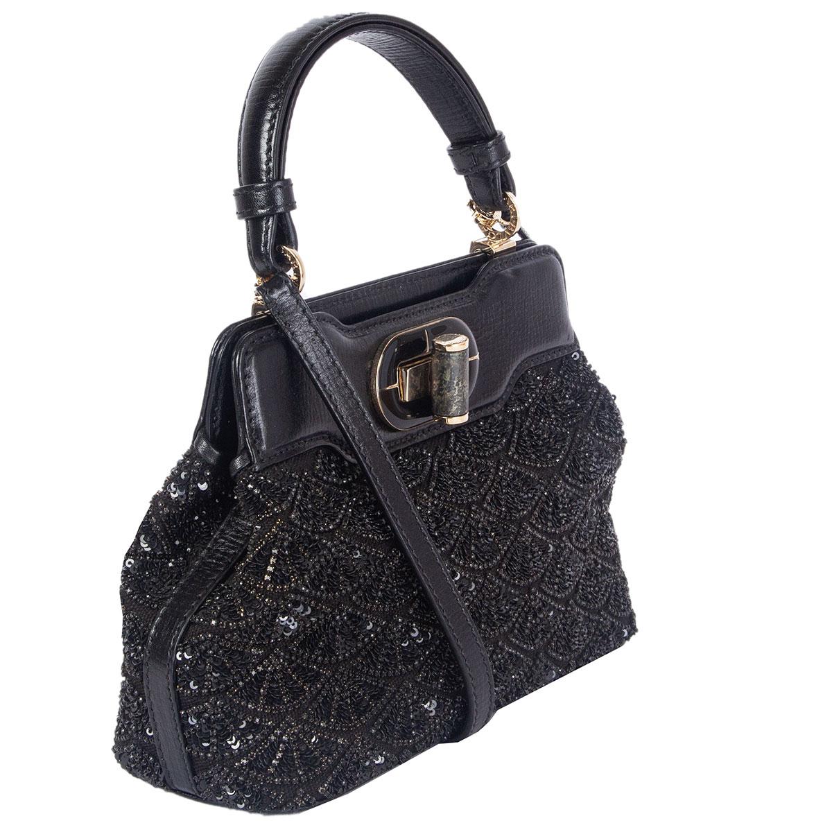 100% authentic Bulgari Isabella Rossellini XS handbag in black canvas and leather embellished with black sequins. Opens with a turn-lock and is lined in black satin with one zipper pocket against the back. Comes with a detachable and adjustable