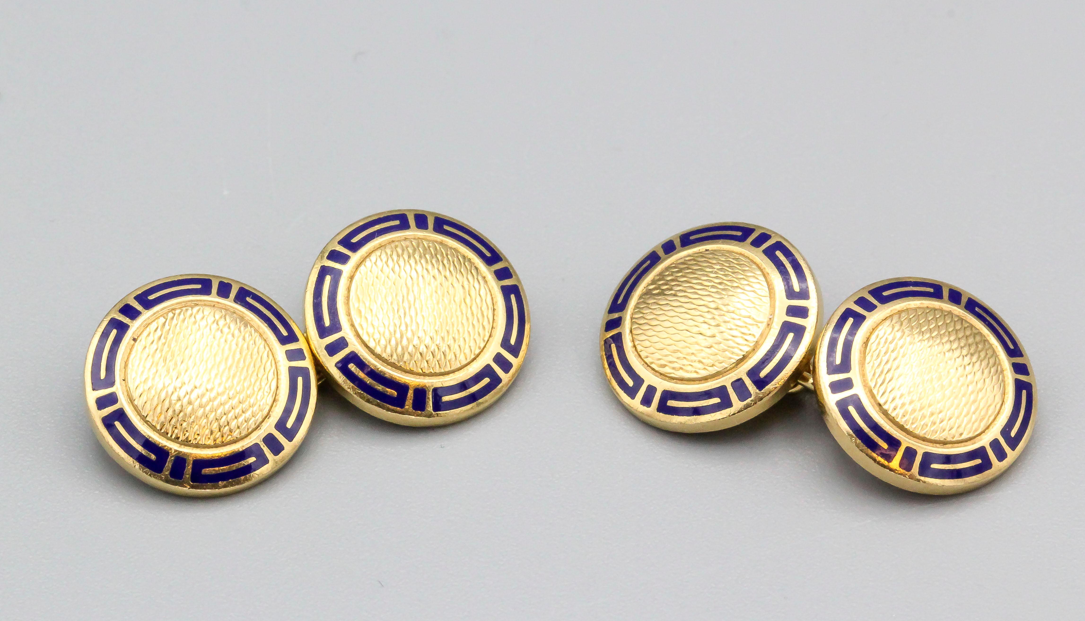 Handsome 18K yellow gold and blue enamel cufflink set by Bulgari. They feature an engine turned design, with blue enamel accents around the edges.  

Hallmarks: Bulgari, 750, Italian standard marks.