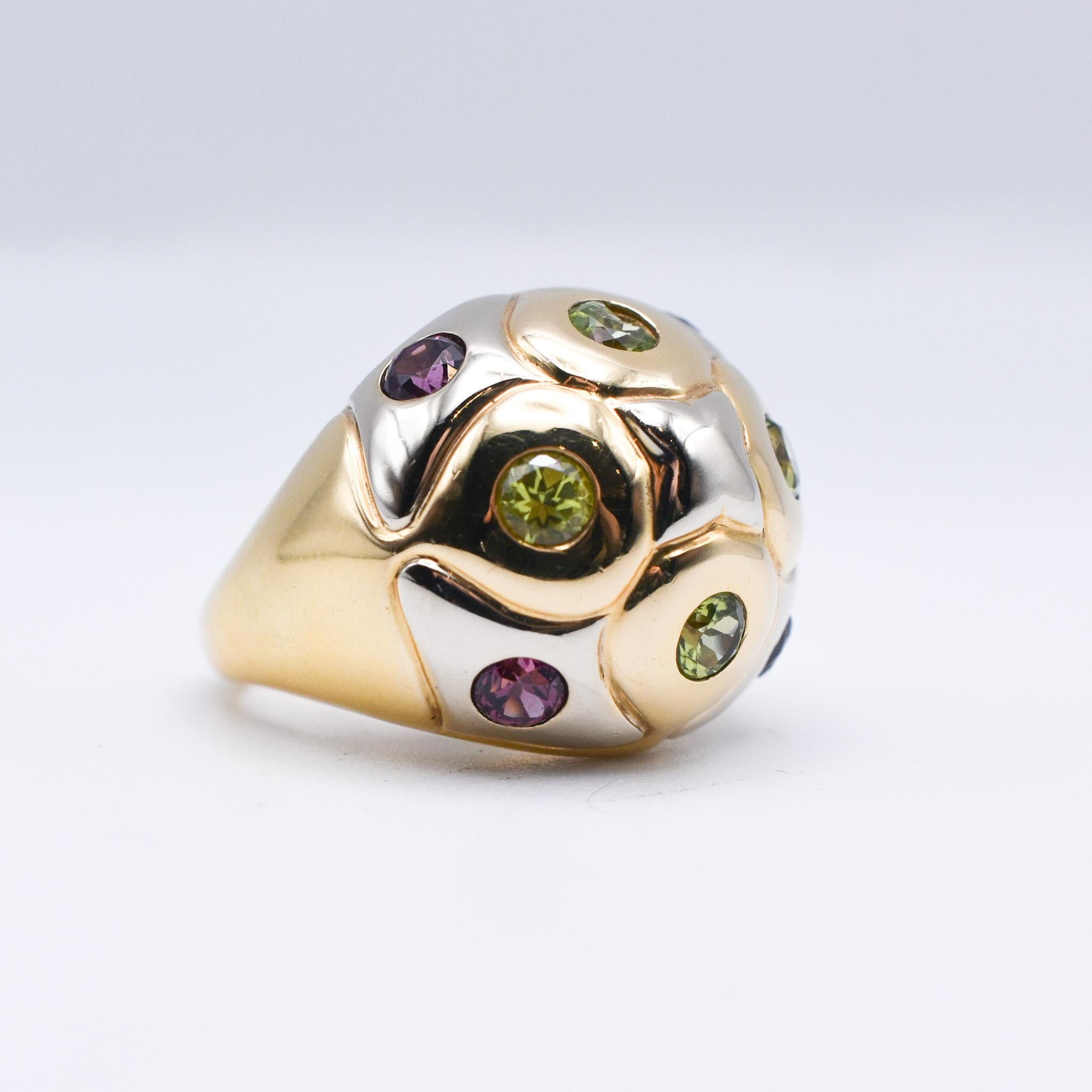 Bulgari Bombé Ring crafted in 18k White and Yellow Gold with Peridot and Amethyst Accents. 
Made in Italy, circa 1980.

Ring size: US 6 3/4.