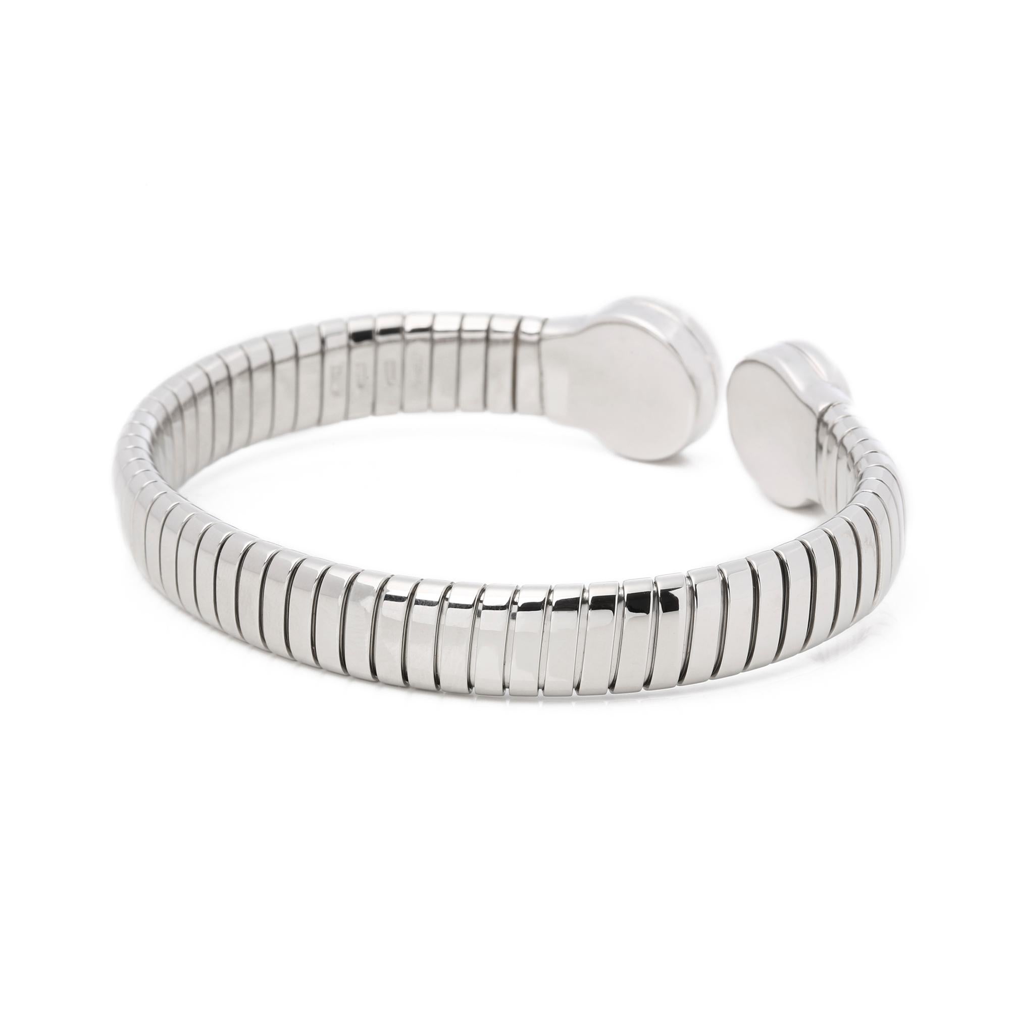 This bangle by Bulgari is from their Bulgari Bulgari collection and features round brilliant cut diamonds, set in stainless steel. Complete with Bulgari box. 