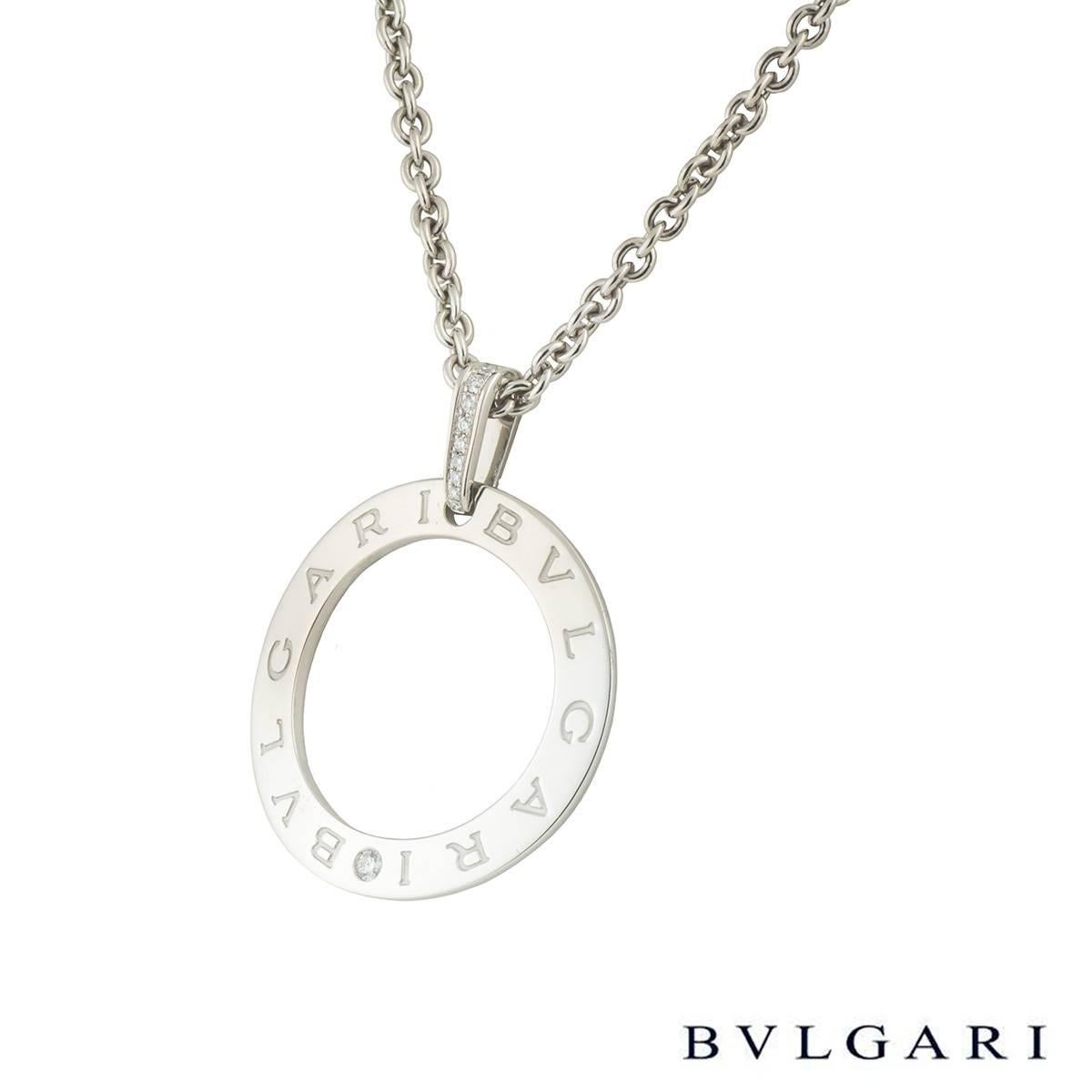 A lovely 18k white gold Bvlgari necklace from the Bvlgari Bvlgari collection. The necklace comprises of a circular openwork motif with 'Bvlgari Bvlgari' embossed around the outer edge. The necklace loop bail has 9 round brilliant cut diamonds in a