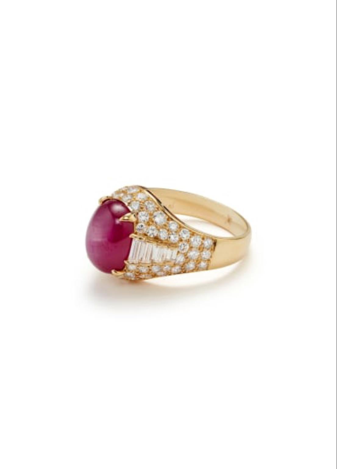 A beautiful Bulgari ‘Trombino’ Ring centering a no-heat cabochon Burma star ruby of approximately 8 carats, surrounded by baguette- and round brilliant-cut diamonds mounted in 18 karat yellow gold. Size 9.75, can be resized.
Accompanied by a GIA