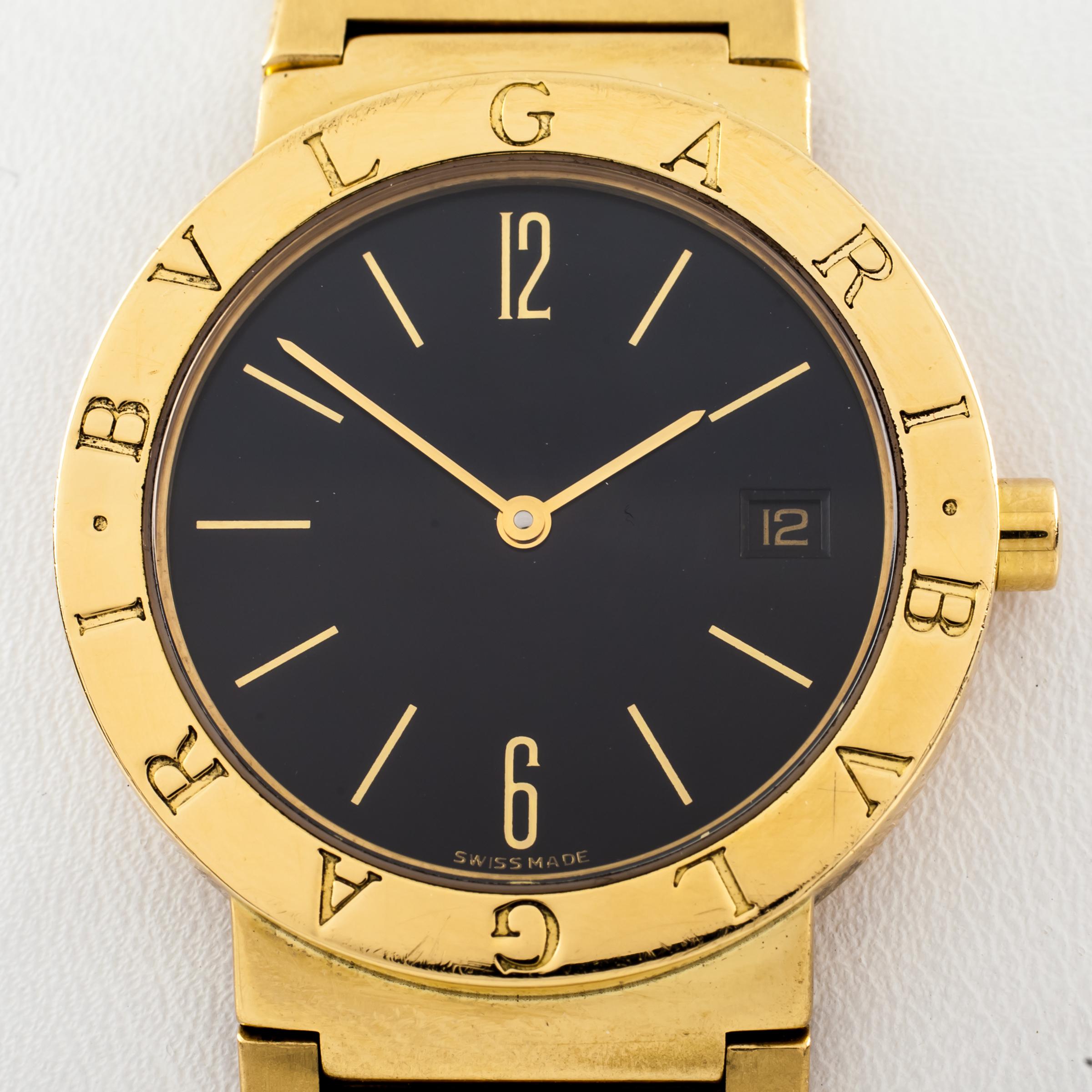 Model #BB 33 GGD
18k Yellow Gold Case
33 mm in Diameter (36 mm w/ Crown)
Lug-to-Lug Distance = 14 mm
Lug-to-Lug Length = 39 mm
Thickness = 6 mm
Black Dial w/ Gold Numbers, Tic Marks, and Hands (M + H)
Includes Date Feature at 3:00
26 mm in