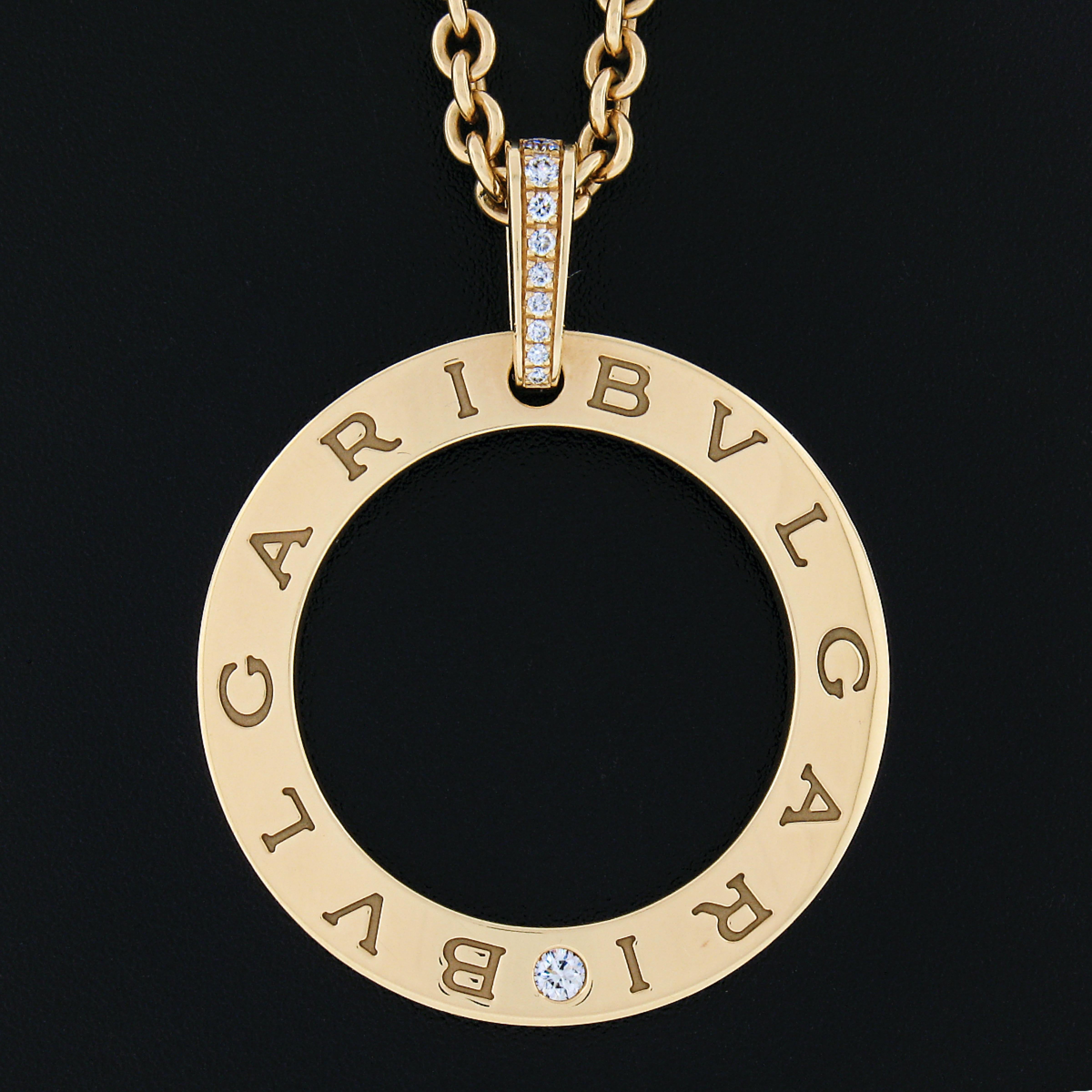 Here we have a gorgeous, 100% authentic, Bulagri statement pendant necklace crafted from solid 18k yellow gold. The pendant is a wavy open circle burnish set with a round brilliant diamond at the bottom and a slightly graduated bail pavé set with 9