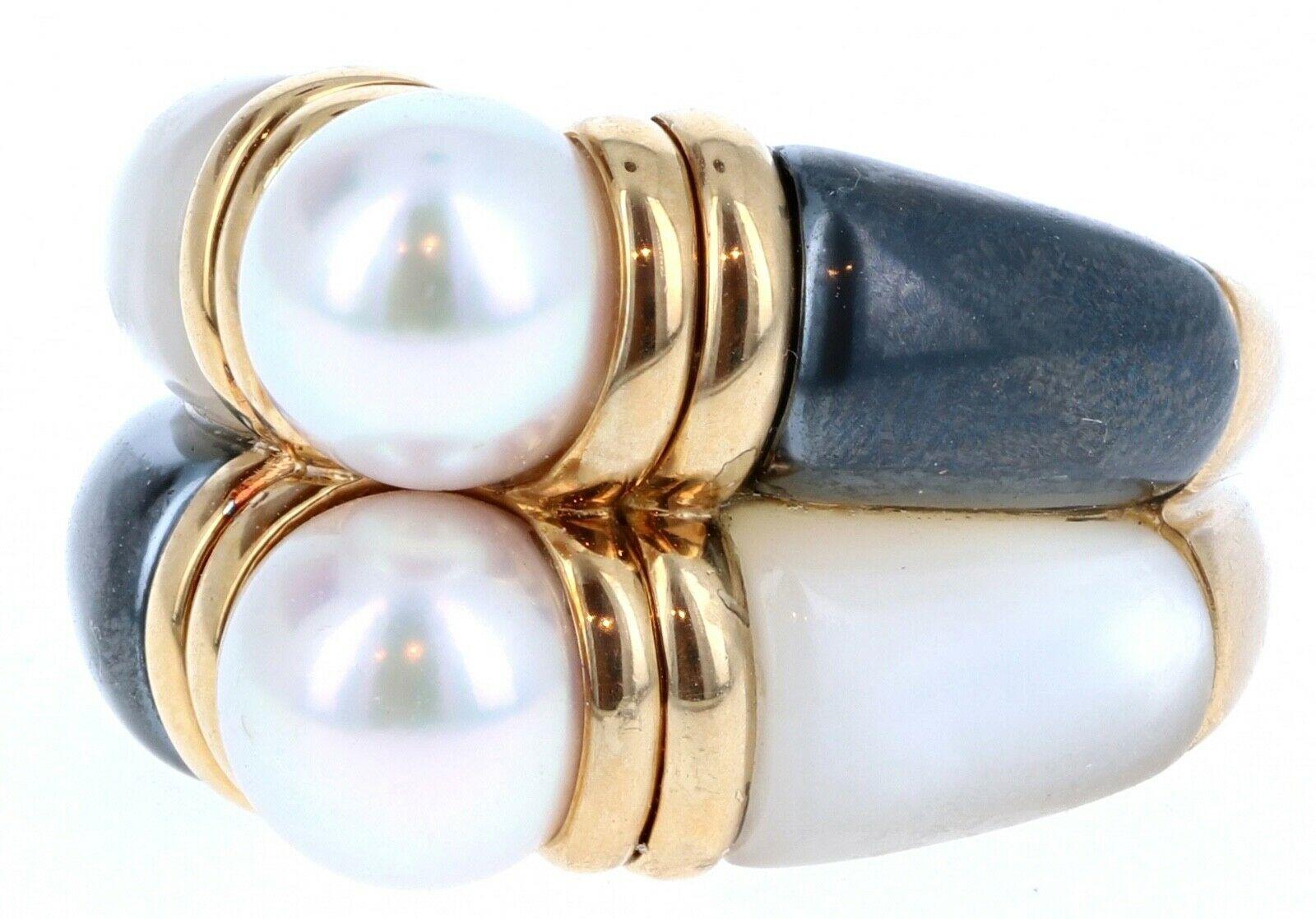 Bulgari Bvlgari 18k Yellow Gold, Pearl, Hematite & MOP Double Band Ring 11.9g 


For sale is this beautiful double band ring by Bulgari.
The ring is comprised of 2 pearls, hematite and mother of pearl. 
The ring is crafted in 18k yellow gold.