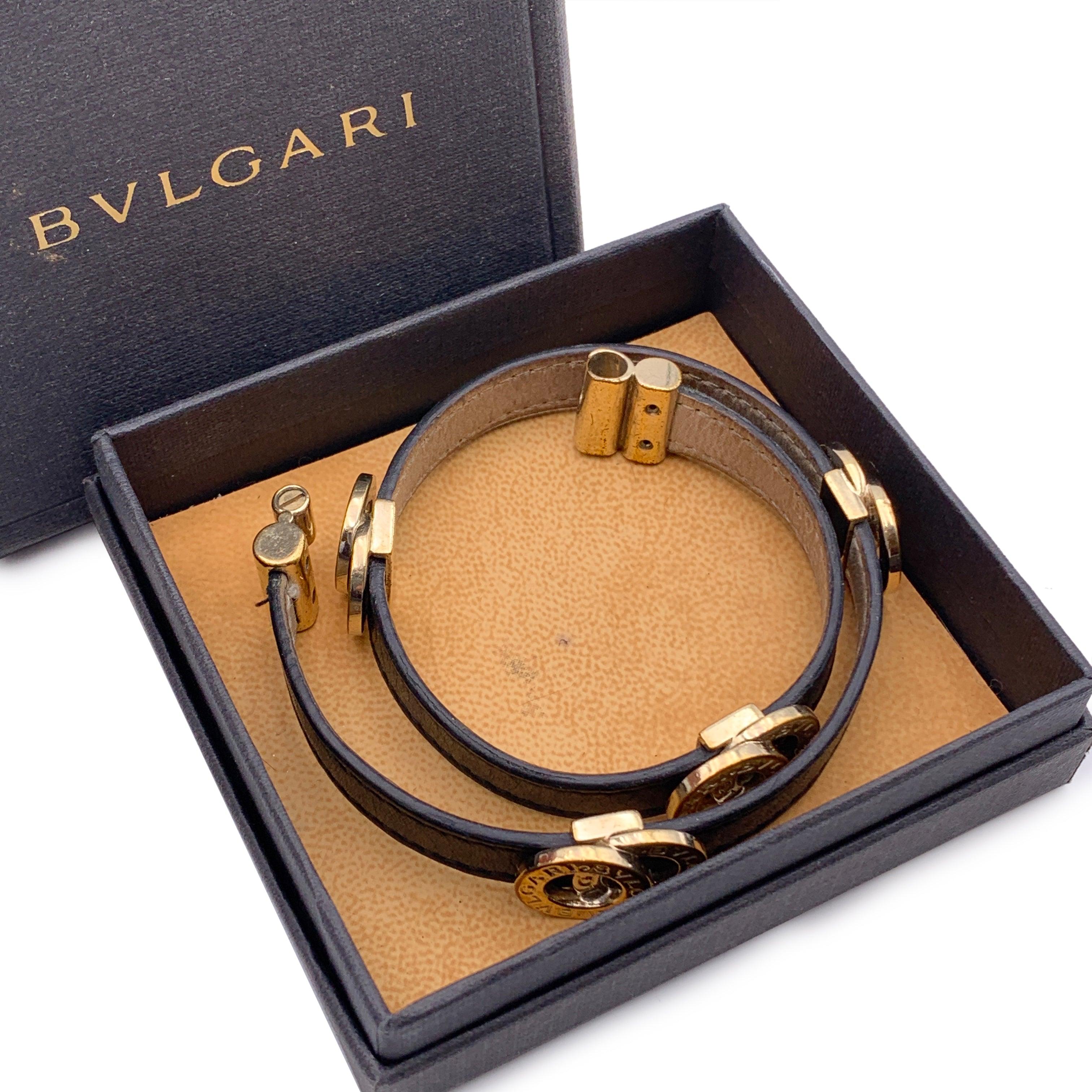 Bulgari Bvlgari Double coiled wrap bracelet in black leather with gold metal interlocking ring. Has been worn and is in excellent condition.BVlgari - made in Italy' engraved inside. Serial number engraved on the back. Total lenght: 14.5 inches -