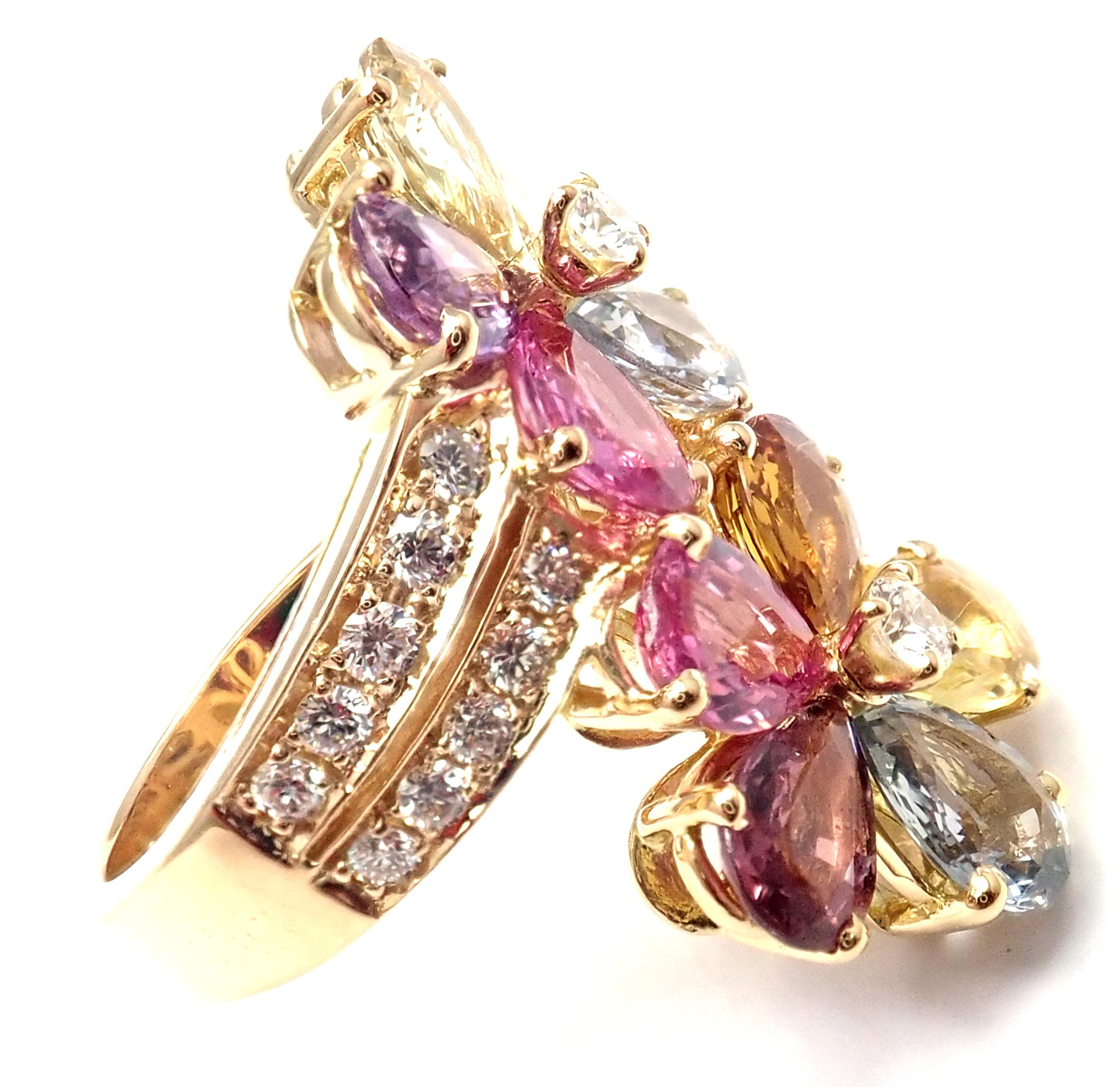 18k Yellow Gold Fancy Color Sapphire Flower Ring By Bulgari.
With 22 round brilliant cut diamonds VS1 clarity, E color total weight approx. .80ct
10 pear shape fancy color sapphires total weight approx. 9ct
This ring comes with original Bulgari