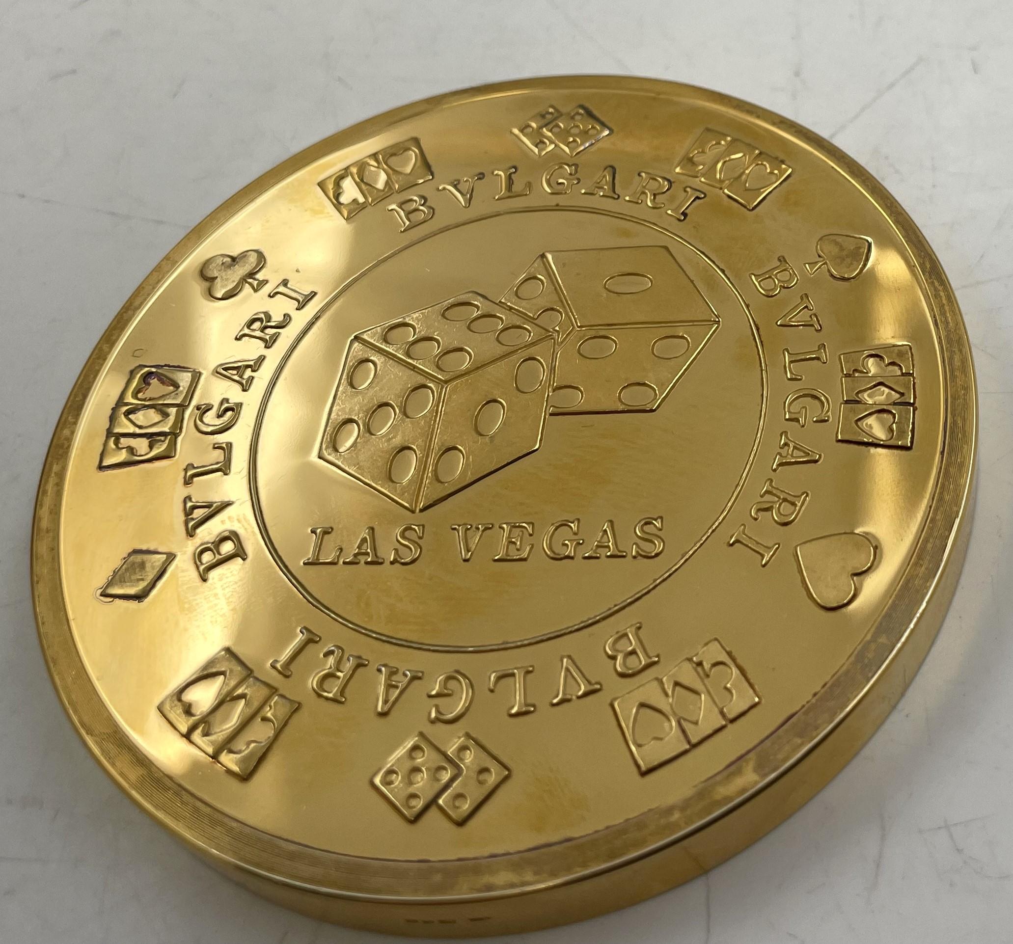 Bulgari or Bvlgari rare gilt sterling silver casino chip coin depicting roulette, and other games, made in England in the late 20th century. It measures 3'' in diameter by 1/4'' in height, weighs 12 troy ounces, and bears hallmarks as shown. It is