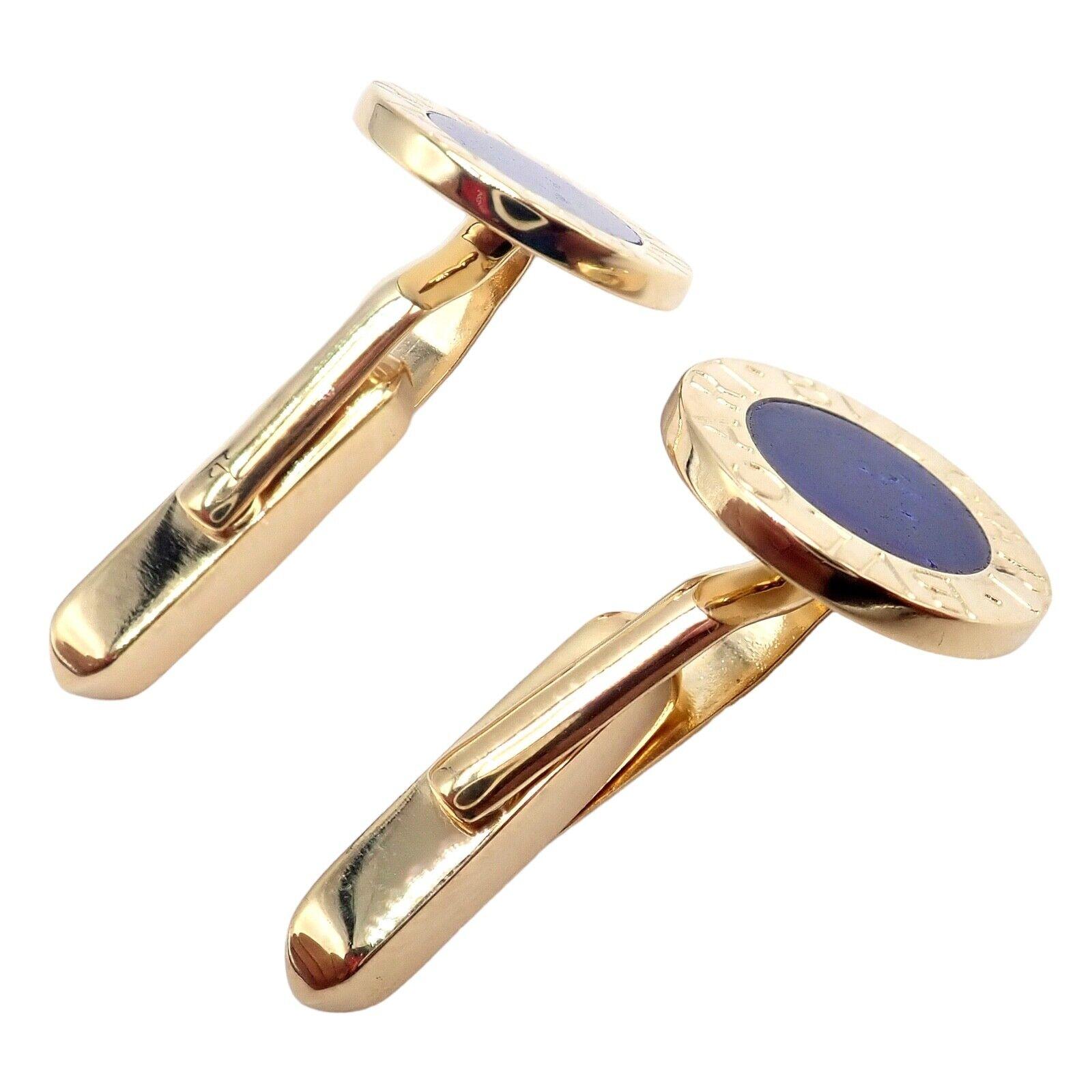 The Authentic Bvlgari Bulgari 18k Yellow Gold Lapis Lazuli Cufflinks are a striking accessory that exudes luxury. Made from 18k yellow gold, these cufflinks feature exquisite lapis lazuli stones. The deep blue hue of the lapis lazuli contrasts