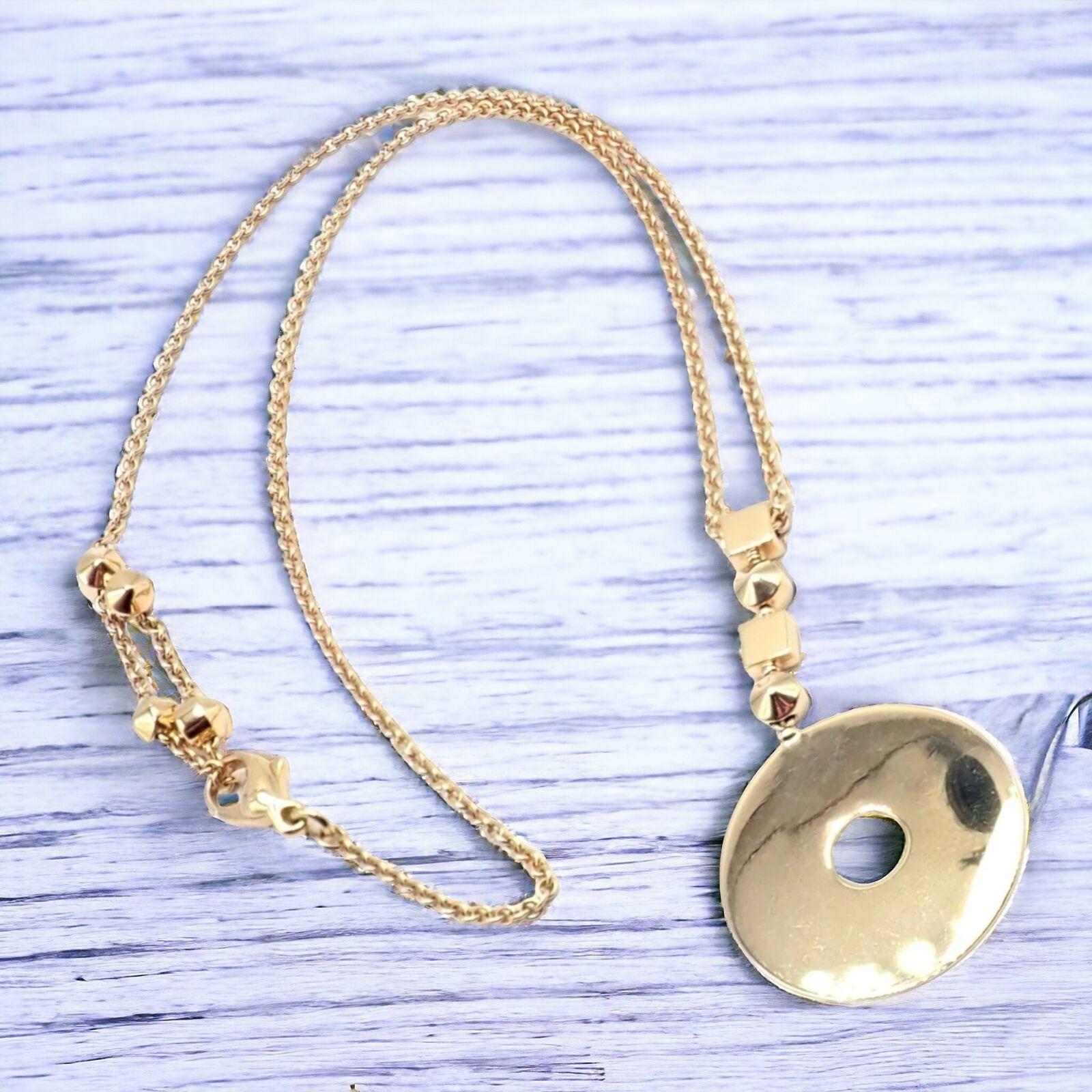 18k Yellow Gold Lucea Necklace by Bulgari.
The Bulgari Bvlgari Lucea 18k Yellow Gold Round Pendant Necklace is a dazzling display of luxury and design. 
This exquisite piece features a luminous 18-karat yellow gold round pendant, embodying Bulgari's
