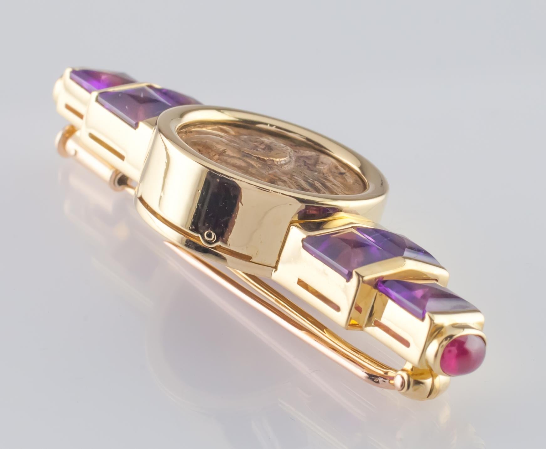 Bulgari Monete Brooch with Point-Cut Amethyst and Ruby Cabochon Accents
Hallmarked with coin variety: MACEDONIA PHILIPPI 4TH CENTURY
Serial #BD 8996
Total Width of Brooch = 52 mm
Length of Brooch = 19 mm
Total Mass = 24.0 grams