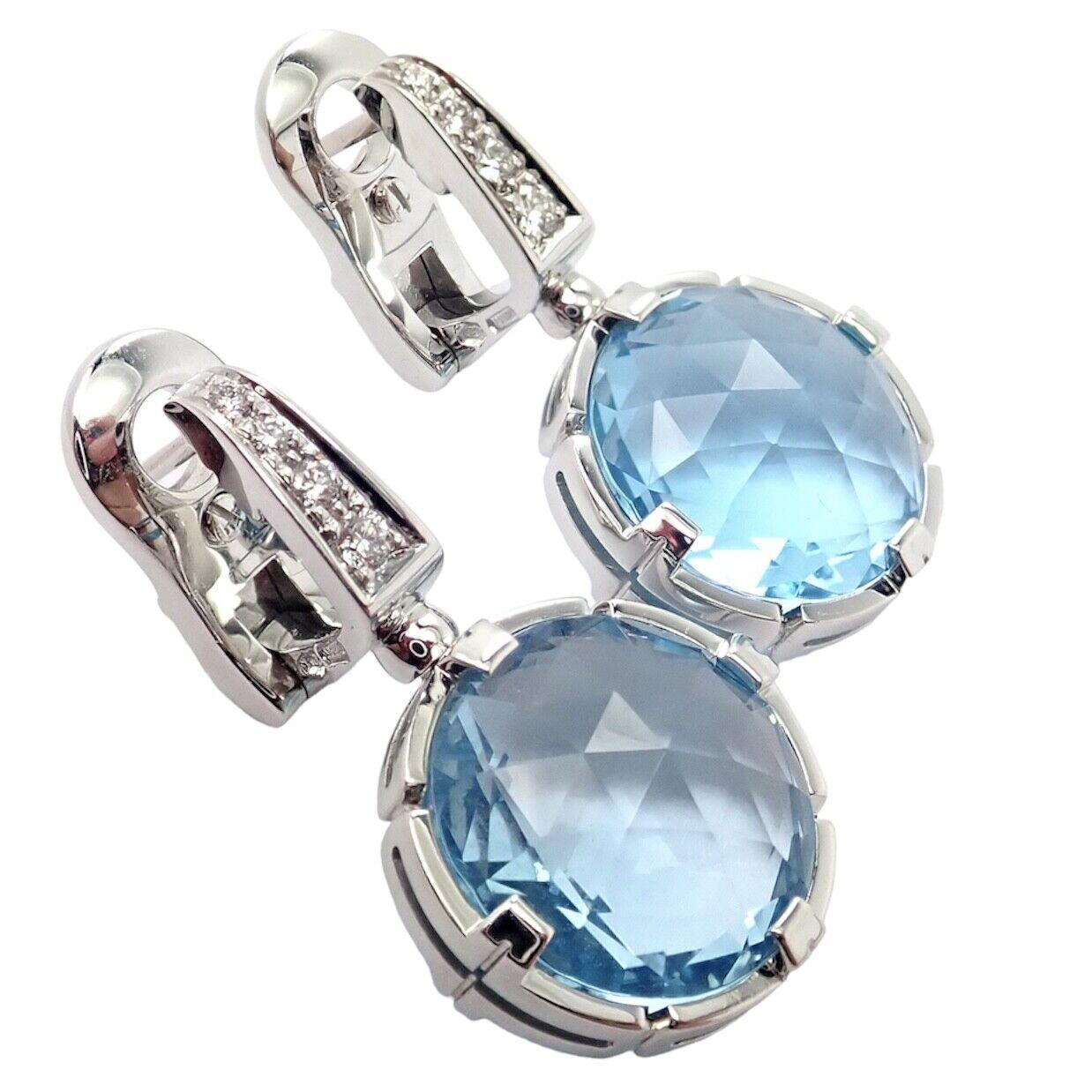18k White Gold Diamond Blue Topaz Parentesi Earrings by Bulgari. 
With 8x round brilliant cut diamonds VS1 clarity, G color total weight approx. 0.10ctw
2x round blue topaz stones 12mm each
These earrings are made for pierced