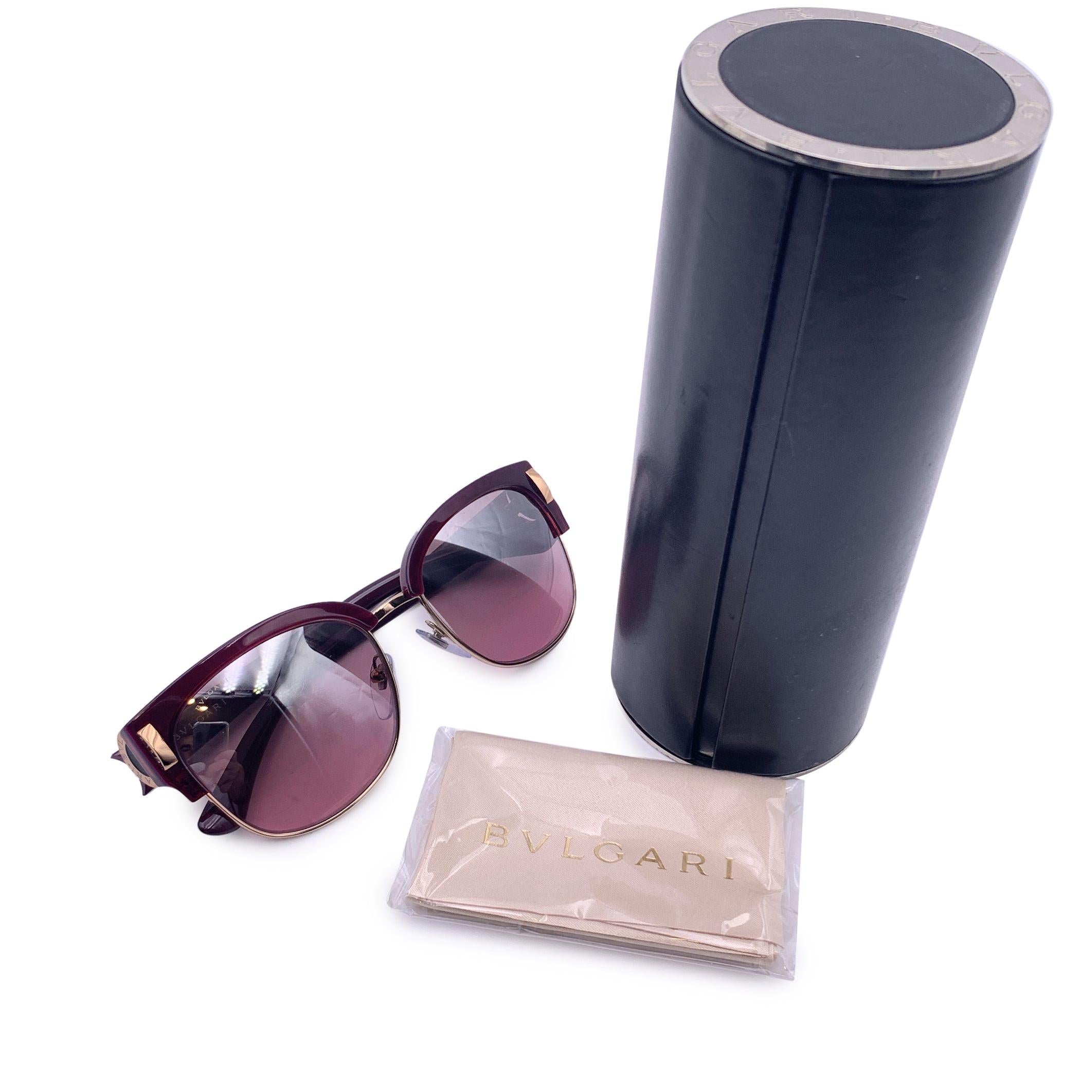 Beautiful sunglasses by Bulgari. Mod. 8189 - 5426/7E - 55/18 - 135 - 2N. Burgundy acetate and gold metal . Gradient purple lenses. 100% UV protection. Condition A - EXCELLENT In excellent condition. Original Bulgari case, cloth and booklet included.
