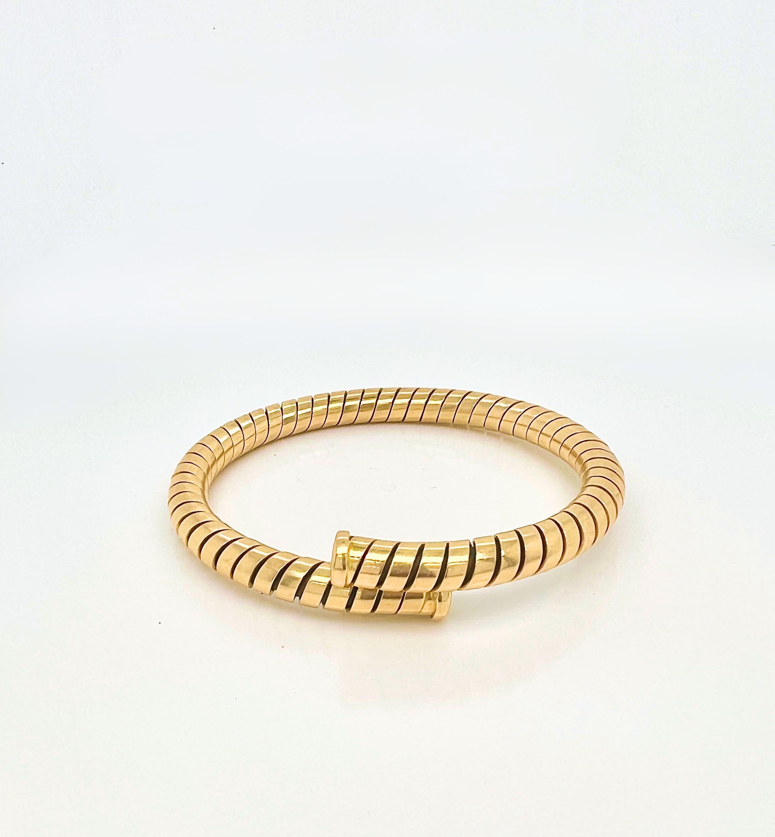 Bulgari Bvlgari Tubogas 18k Yellow Gold Flexible 1980 Bangle Bracelet

Detail:
18k yellow gold, 1980s, flexible and stretchable, Weight 24.8 grams.

In excellent condition