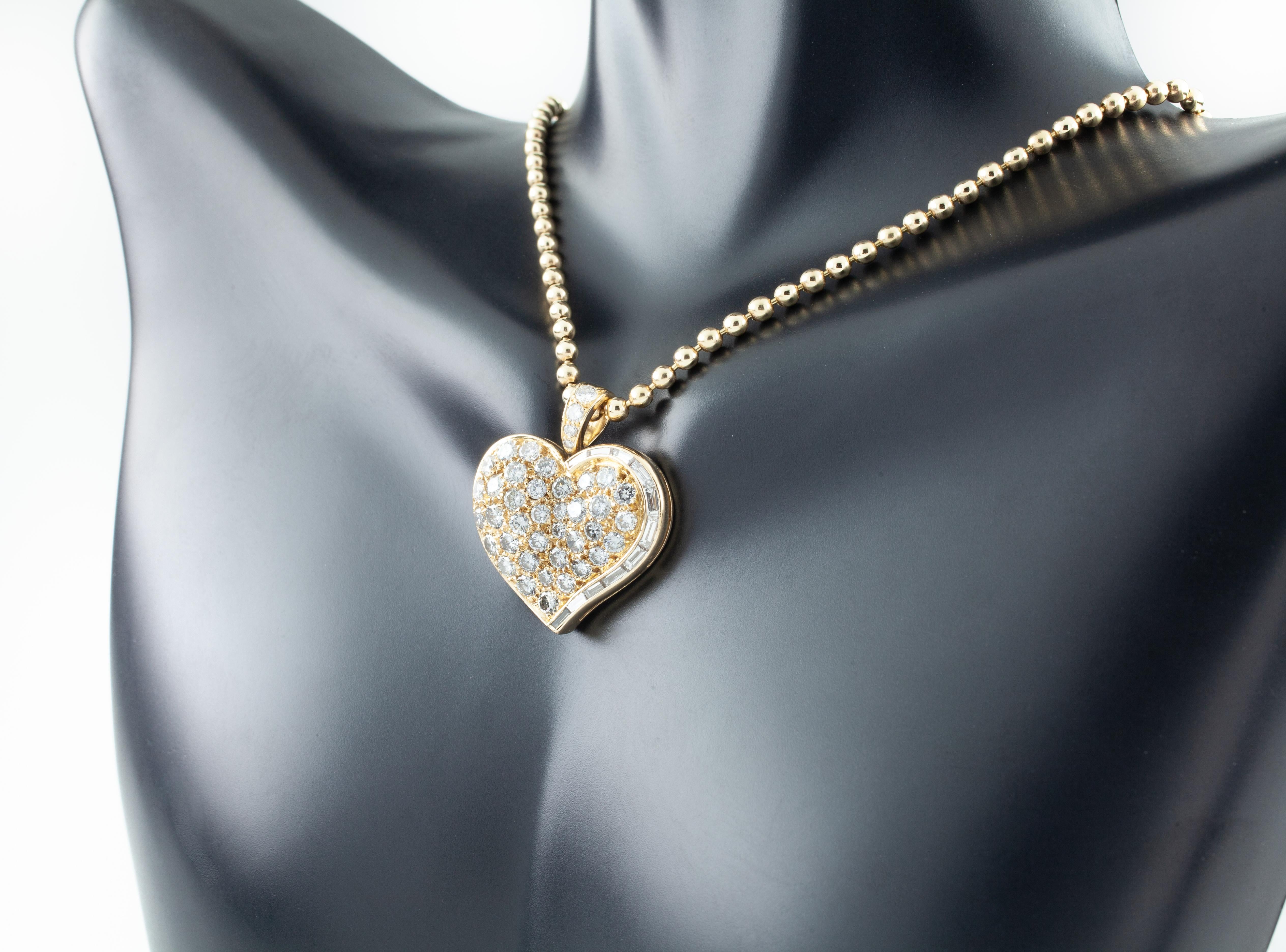 Gorgeous Vintage Bvlgari Heart Pendant
Features Custom-Set Pave Round Diamonds
Features Custom-Cut Channel-Set Baguette Cut Diamonds
Approximately Dimensions of Heart = 23 mm Wide x 18 mm Long (26 mm including bail)
Includes 15