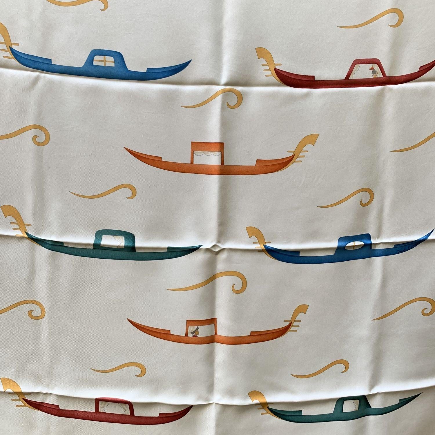 Beautiful vintage Bulgari silk scarf, titled 'Gondola' design. Black, yellow, white colors. 100% Silk. Approx. Measurements: 34 x 34 inches - 86,3 x 86,3 cm. Bulgari composition and care tag is still attached Details MATERIAL: Silk COLOR: Yellow