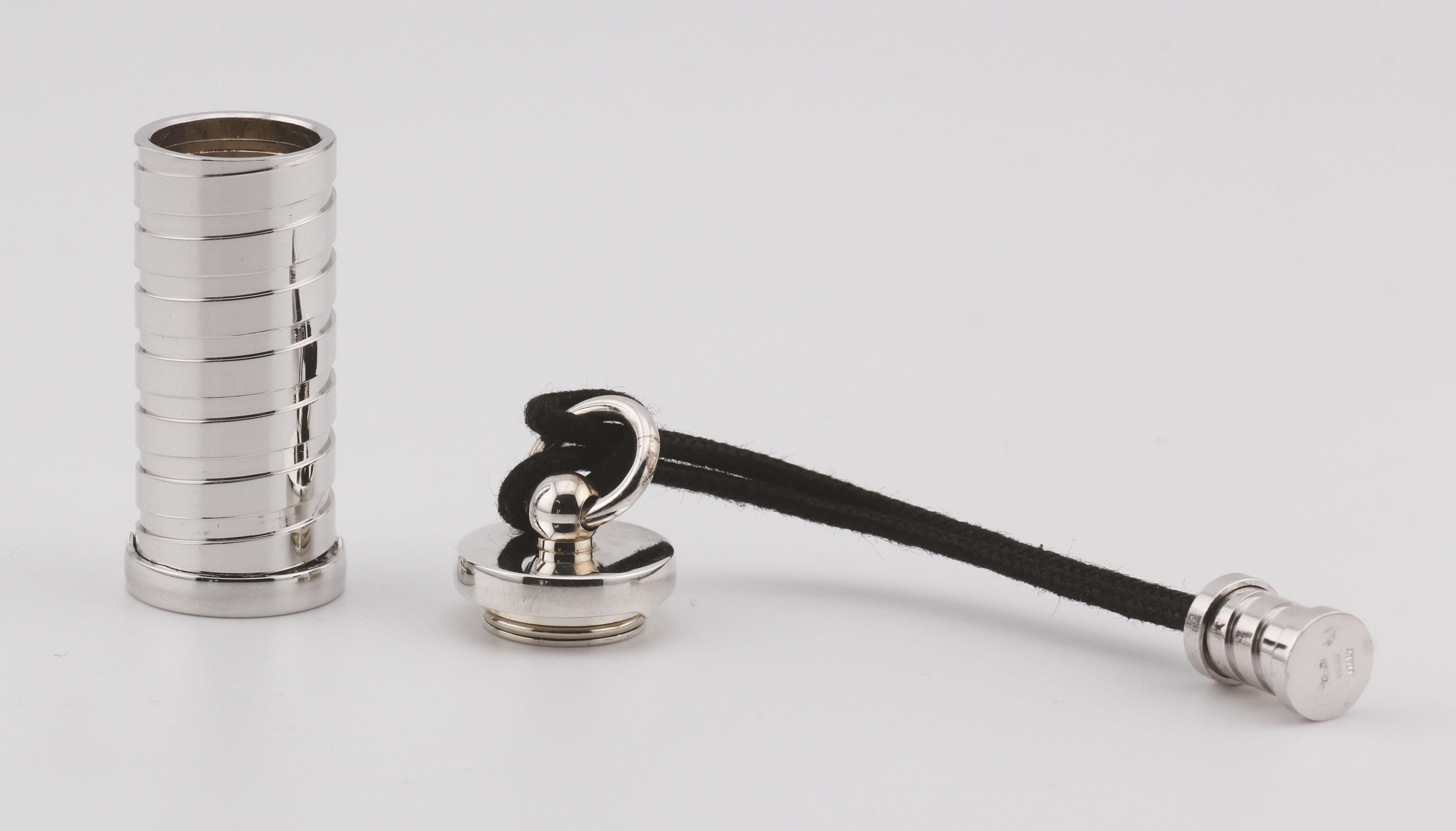 The Bulgari B. Zero 925 Sterling Silver Pill Box Case with Leather Cord is a luxurious, modern accessory that reflects Bulgari’s signature bold and sophisticated style. Crafted from high-quality 925 sterling silver, this pill box takes inspiration