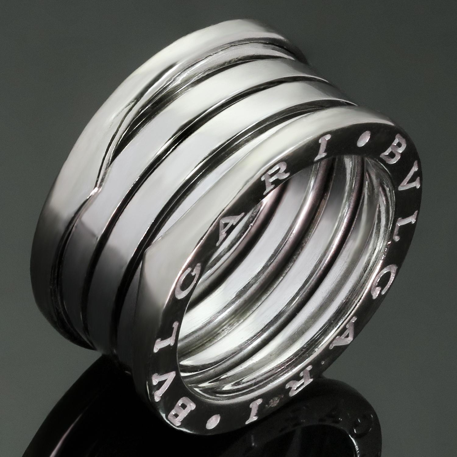 This unisex ring from Bulgari's iconic B.zero1 collection is crafted in 18k white gold and features a three-band design engraved with the Bvlgari logo on both sides. Made in Italy circa 2010s. Measurements: 0.43