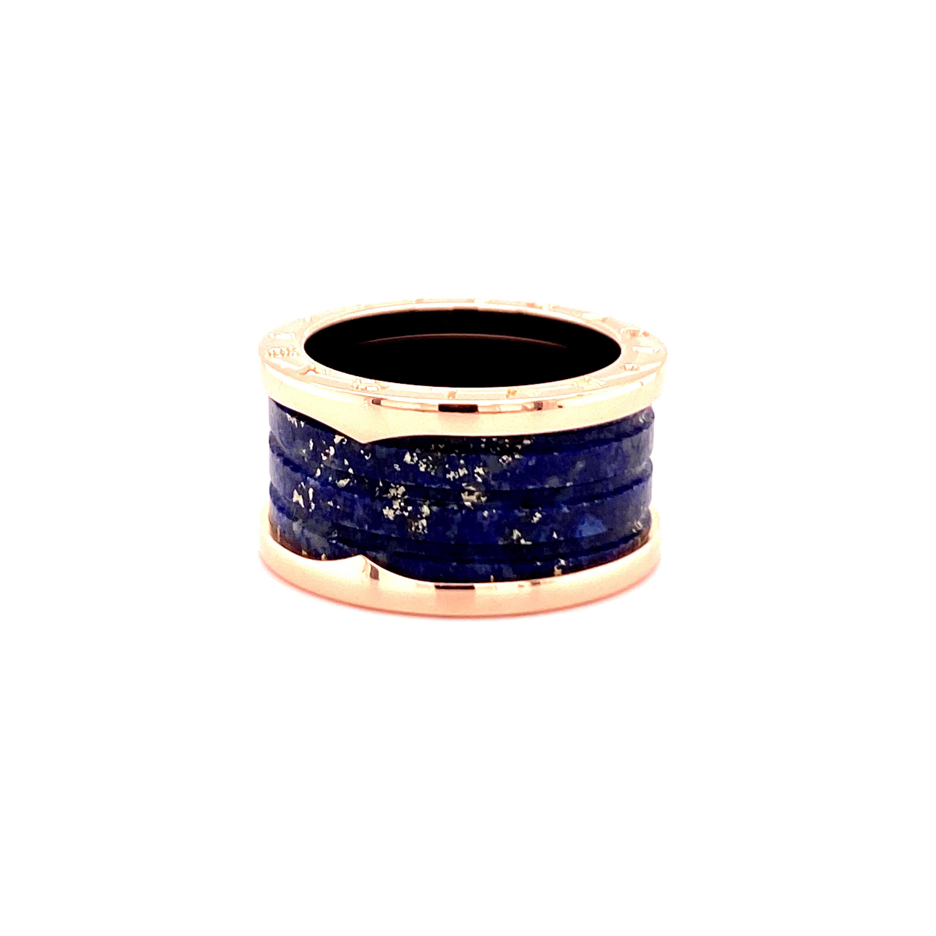 Timeless B.Zero Lapis Lazuli band ring by Bulgari in 18 karat rose gold.

B.Zero1 Collection
Ring Size: 55 (EU), 7.5 (US)
Width: 12 mm, 0.47 in
Stamped Hallmarks: Bvlgari 750 55 A916W2 Made in Italy