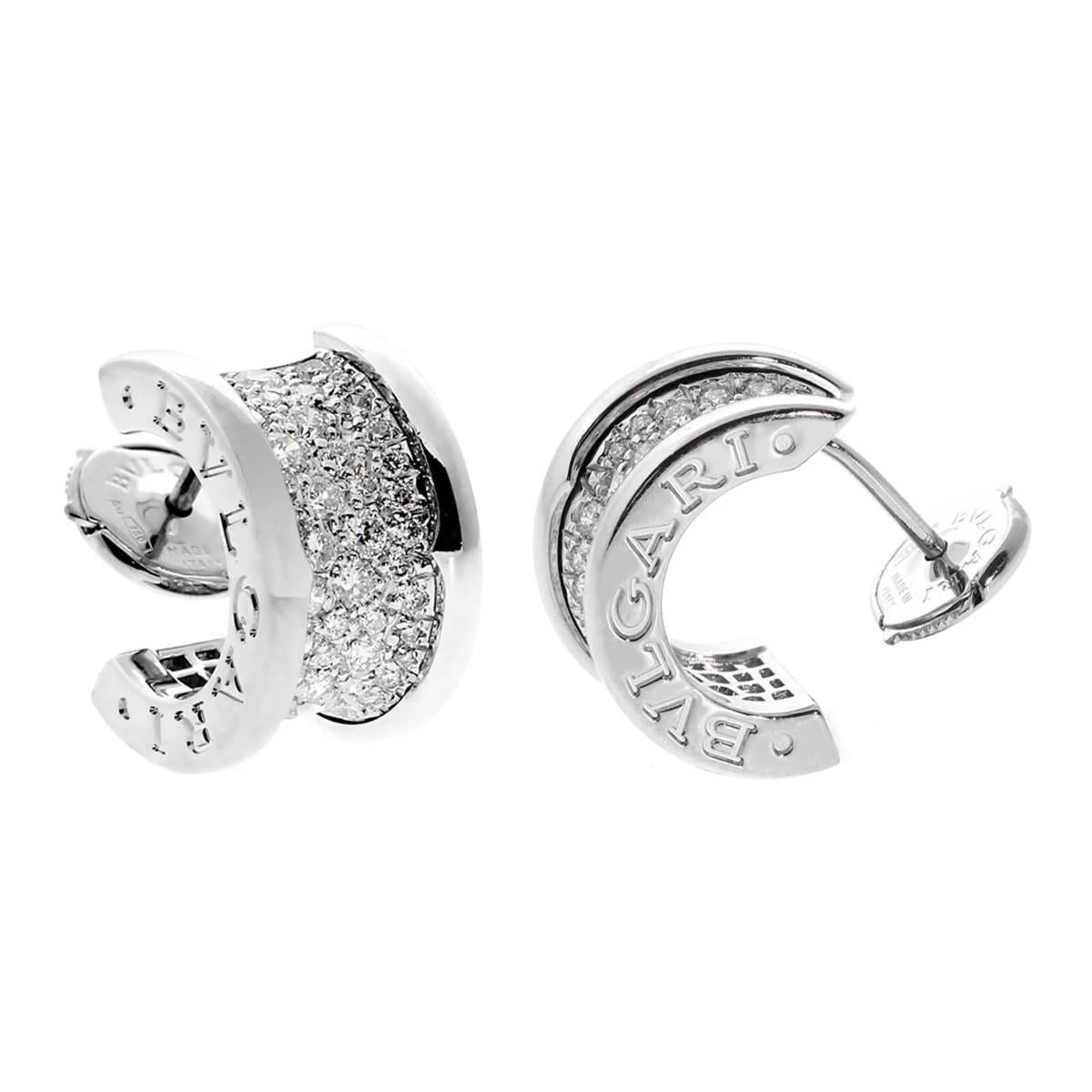 A magnificent pair of authentic Bulgari B.Zero1 earrings set with the finest Bulgari round brilliant cut diamonds in shimmering 18k white gold. The earrings measure .35