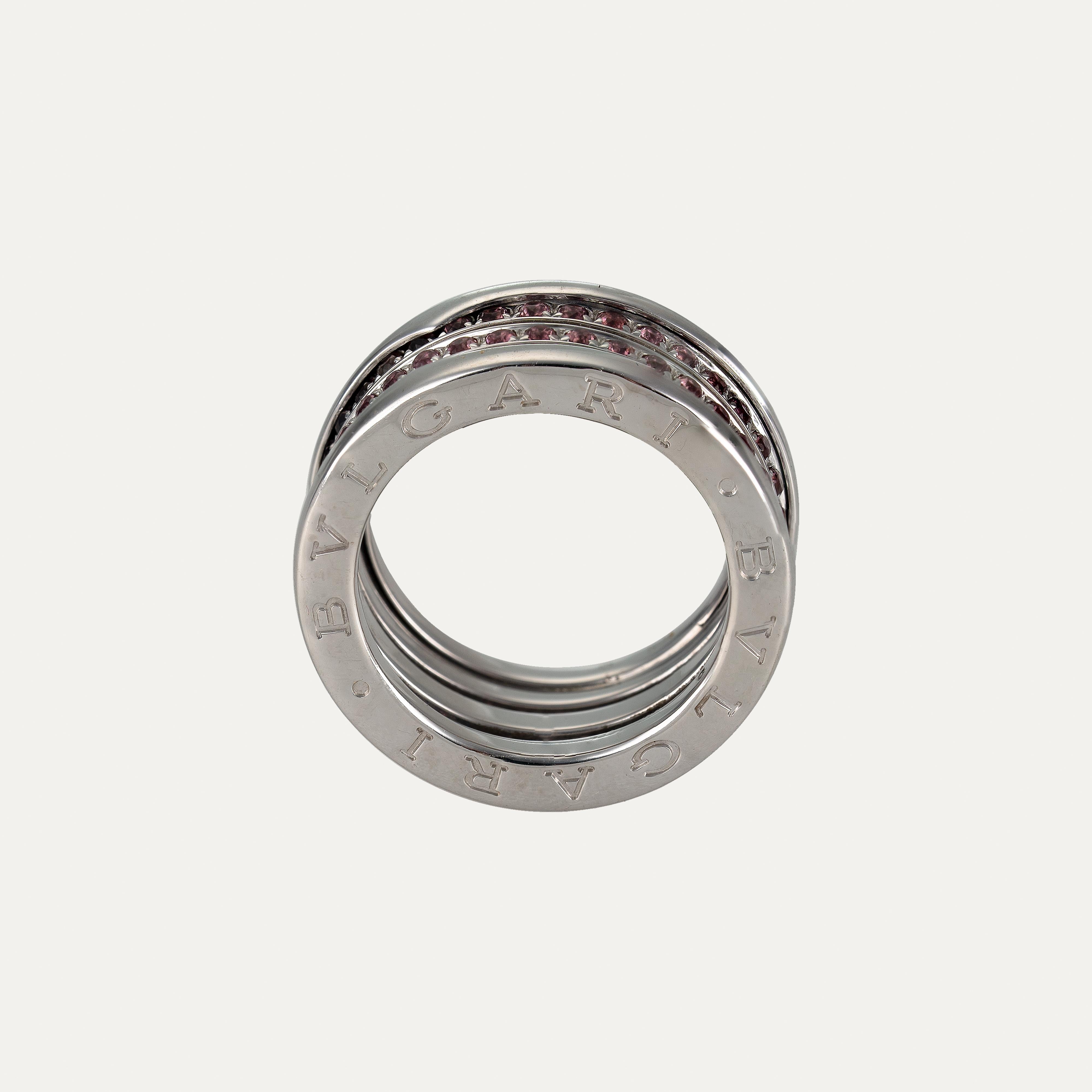 Bold, architectural and unmistakably iconic, this Bulgari B.Zero1 Rhodolite White Gold Band Ring captures the spirit of contemporary Italian design. Inspired by the grandeur of Rome’s Colosseum, the B.Zero1 collection is a celebration of modernity
