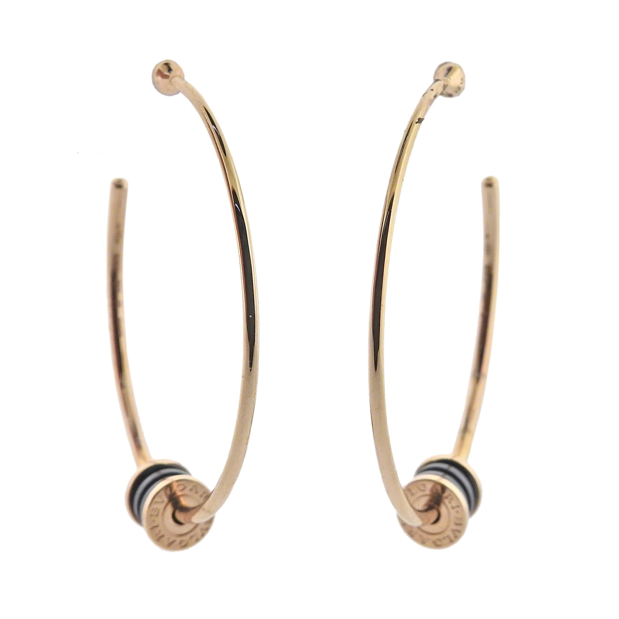 18k rose gold hoop B.Zero1 earrings by Bvlgari, with black ceramic. Retail $3050. Comes with COA and box. Earrings are 42mm in diameter, charm is 8mm x 7mm. Marked Bvlgari, made in Italy, Italian mark, 750, Serial number. Weight 10.1 grams