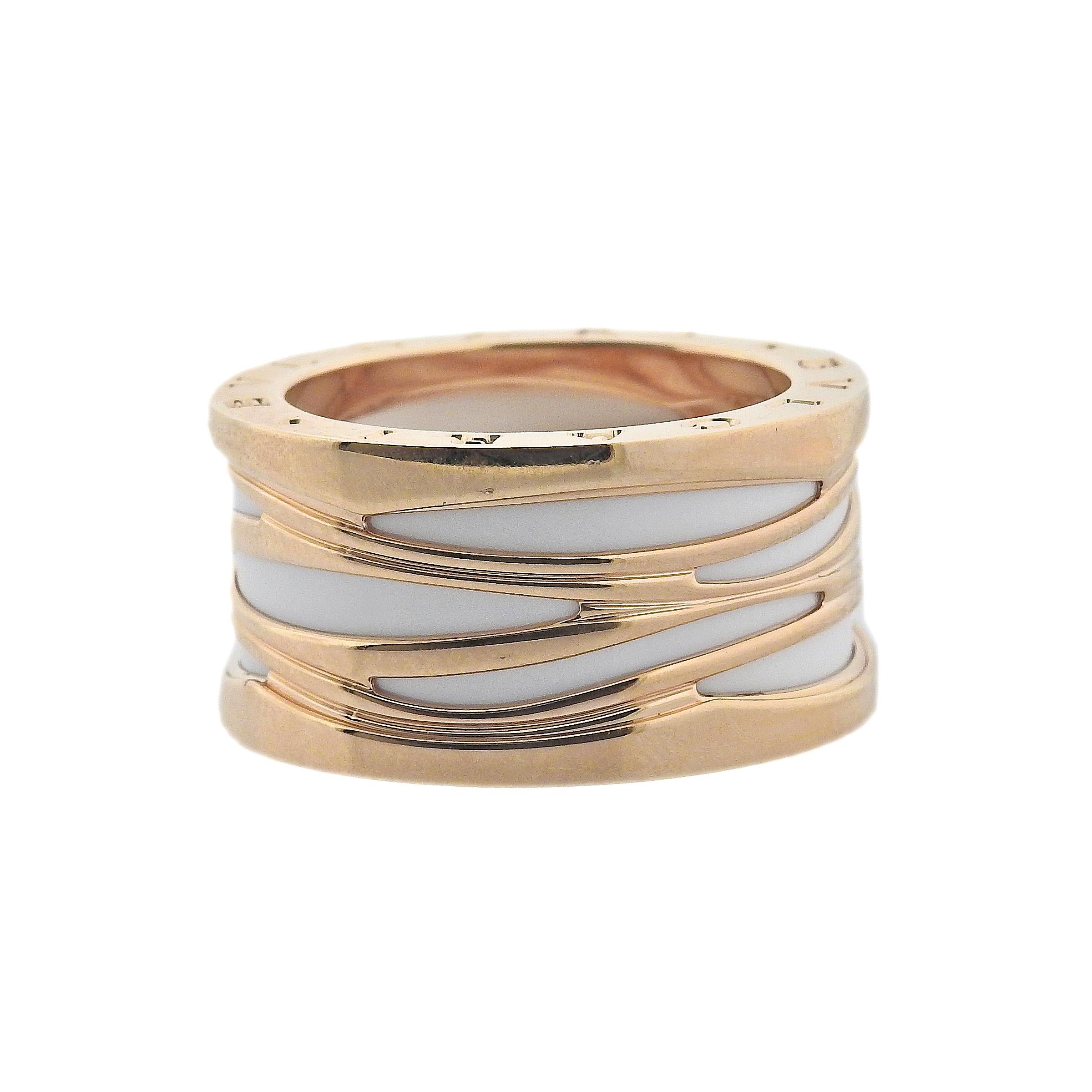 18k rose gold B.Zero1 band ring by Bvlgari with white ceramic. Ring is available in following sizes: 52, 59, 65, ring is 12.5mm wide. Marked: Bvlgari, Italian Mark, 750, Serial Number. Weight is 18.6 grams. Retail $3100. Comes with COA and box.