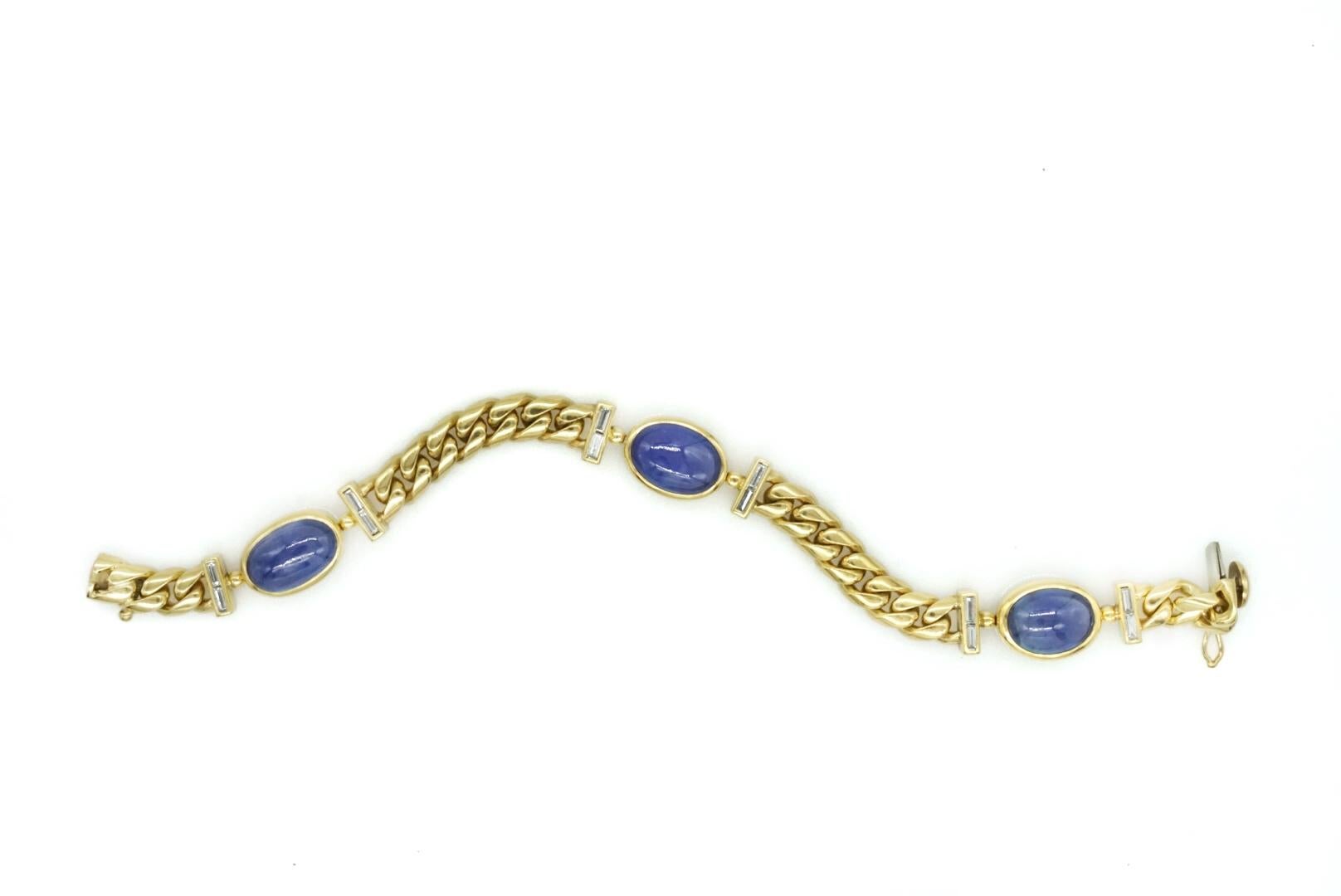 Bulgari Cabochon Blue Sapphire and Diamonds Bracelet mounted in 18k Yellow Gold. Made in Italy, circa 1970. Certificate for sapphires available.