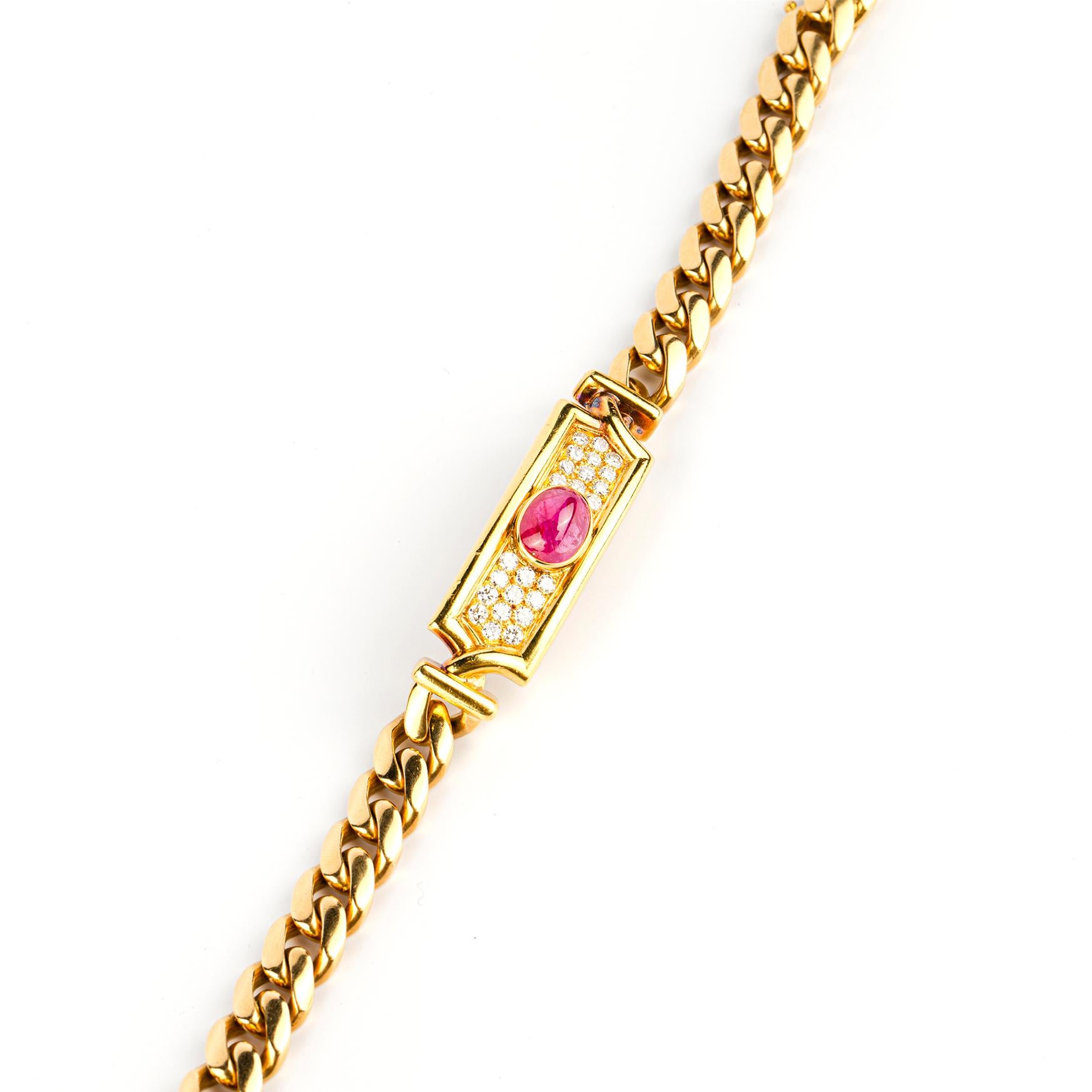 Bulgari bracelet in 18k yellow gold centered by a cabochon ruby plaque with diamond accents. Made in Italy, circa 1980.