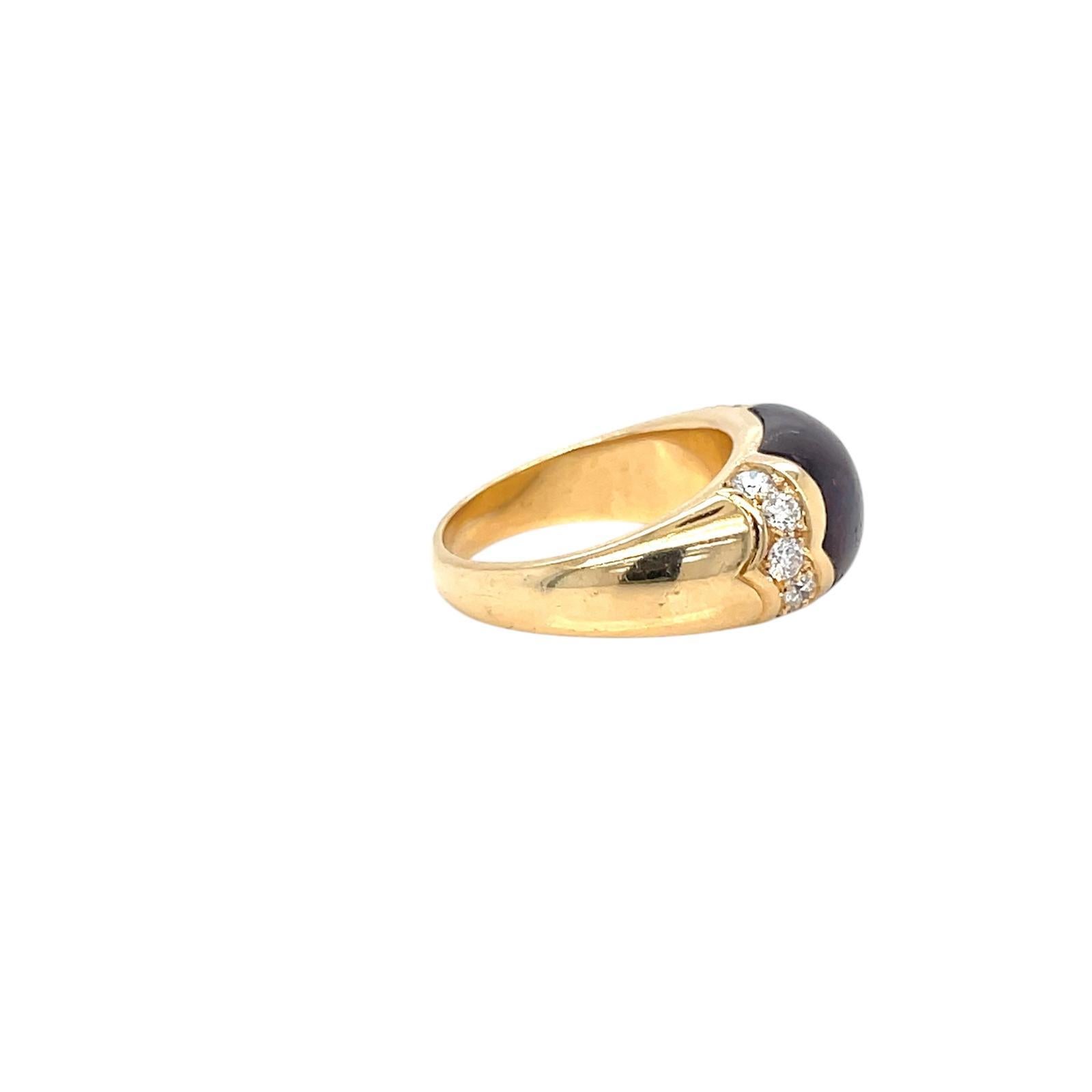 Vintage Glamour Celtaura ring designed by Bvlgari.

A geometric ring band, crafted in Rome Italy by the house of Bulgari in solid yellow  18k gold, it features one sparkling intense pink Tourmaline, surrounded by 1 carats of colorless sparkling