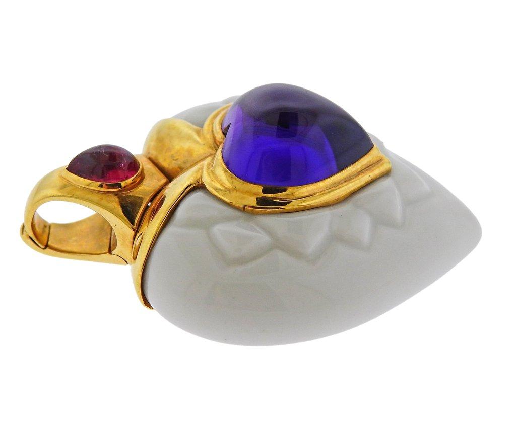 18k gold and white ceramic heart pendant by Bvlgari, set with amethyst and pink tourmaline.  Pendant is 42mm x 34mm. Weight is 22.9 grams. Marked made in Italy, Bvlgari, 750, Italian mark.