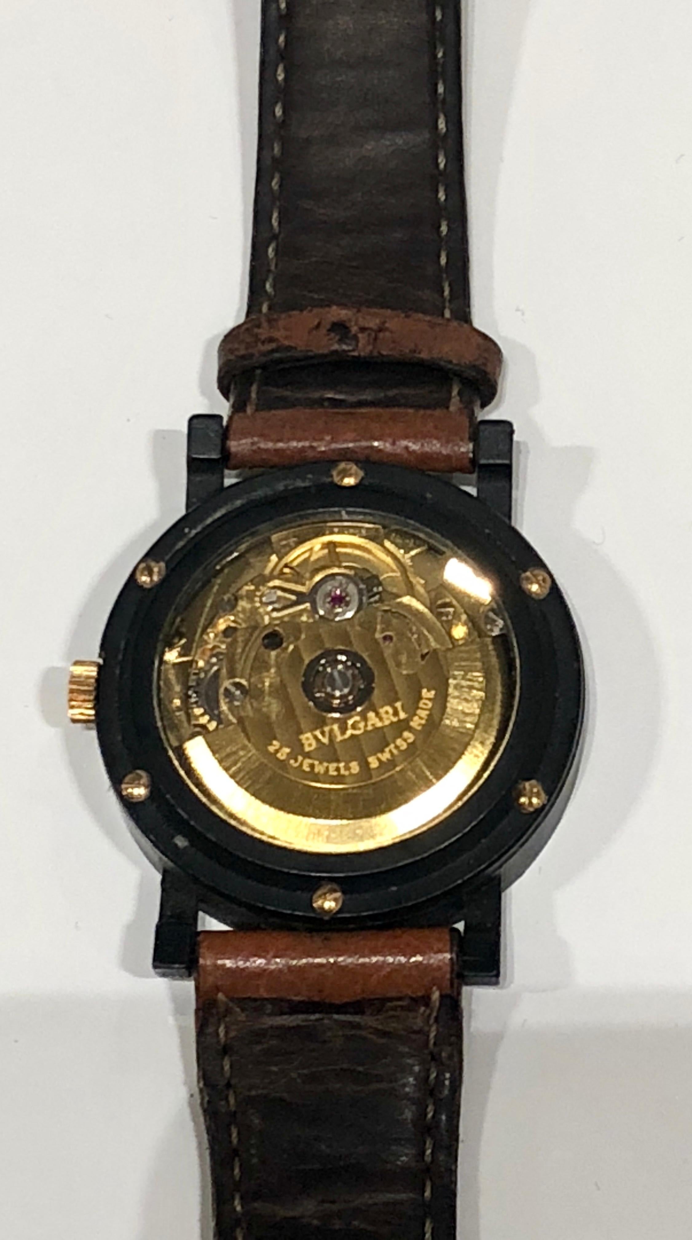 Automatic black ceramic and gold Bulgari watch. Limited Edition 011/200 Dubai.  See  through glass backing. Brown leather bulgari wrist band, worn 