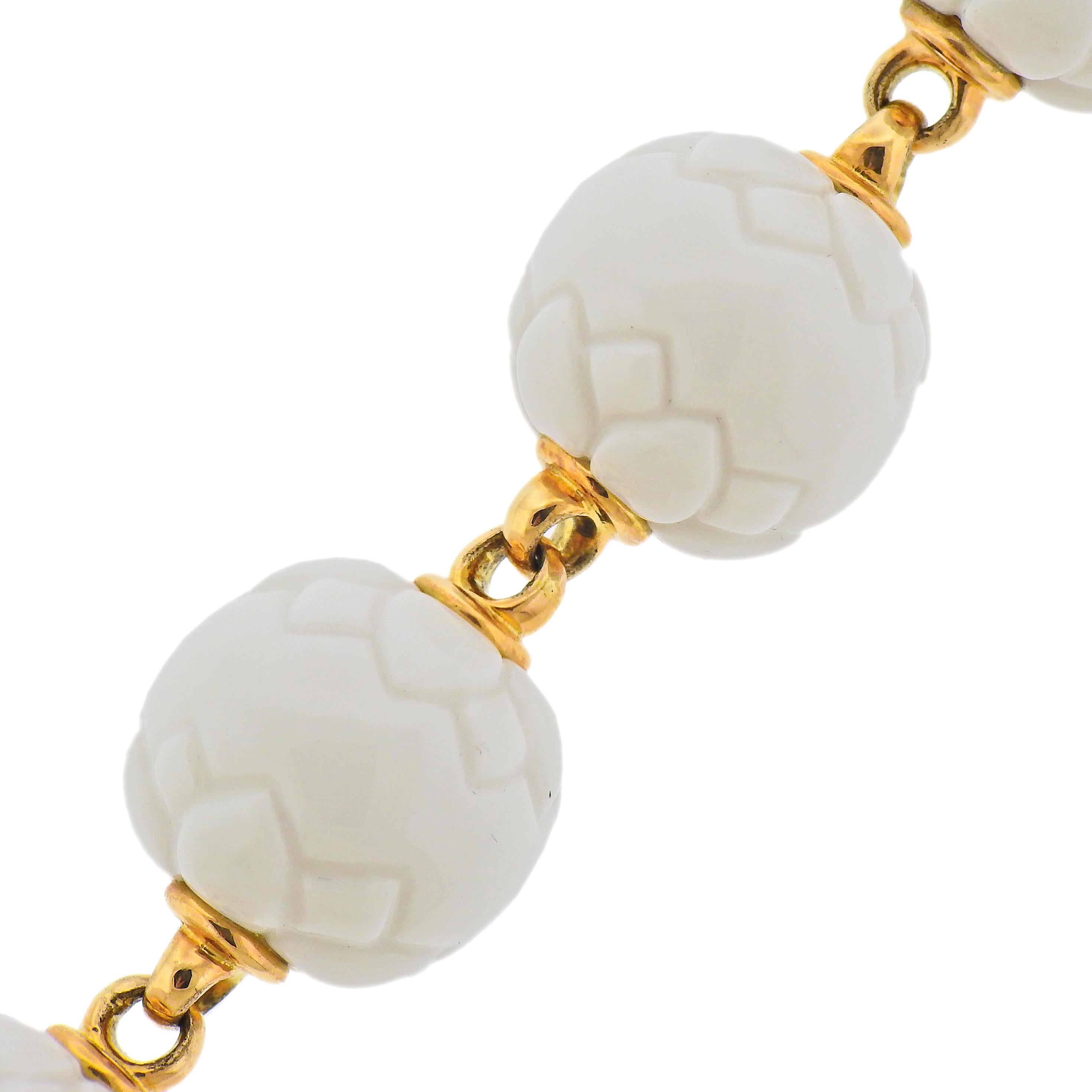 Bvlgari 18k gold bracelet with white ceramic balls. Bracelet is 8.5
