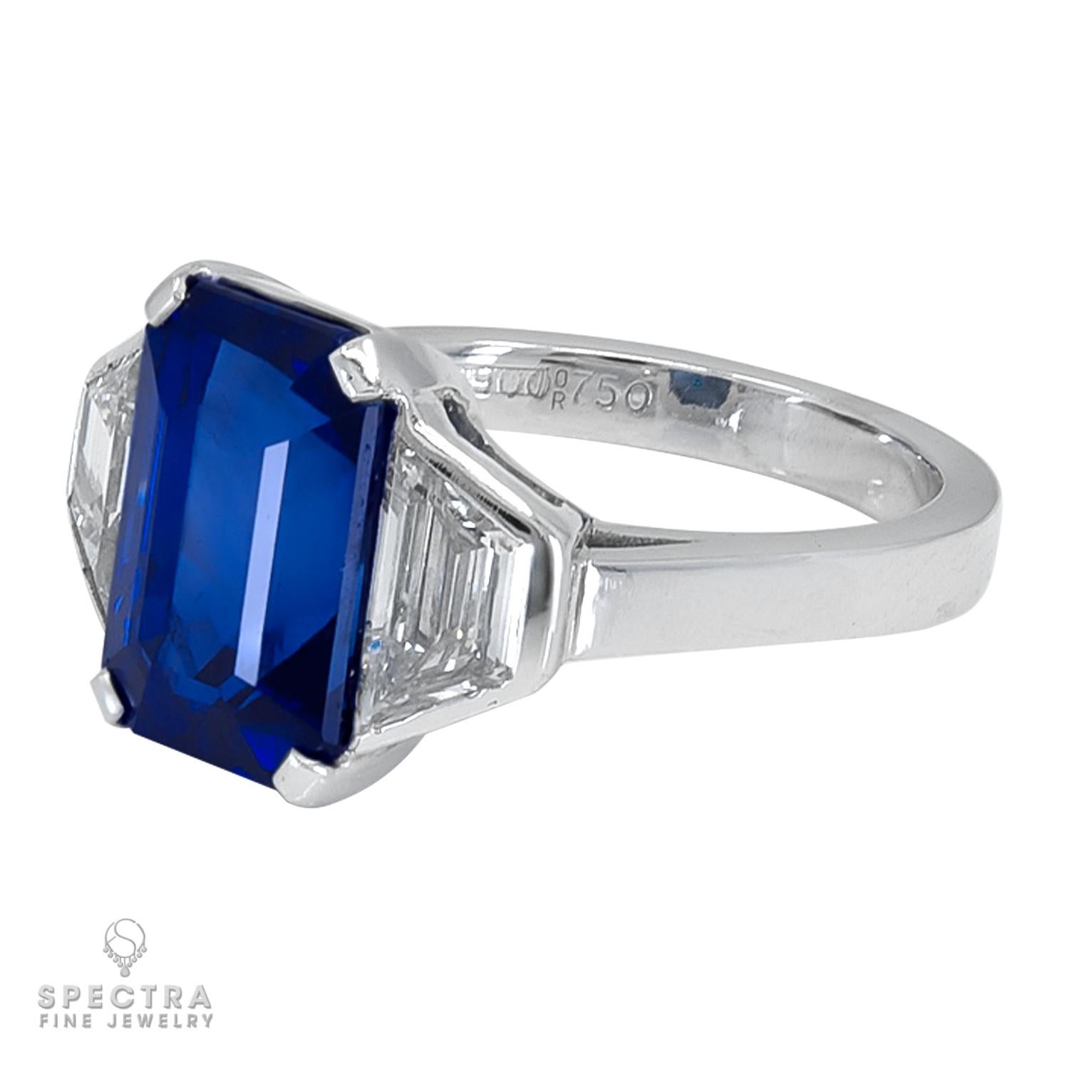 This exquisite Bulgari cocktail ring is a true masterpiece of luxury jewelry, featuring a stunning 6.40-carat royal-blue emerald-cut sapphire flawlessly set in 18K white gold. The sapphire is a natural and rare treasure certified by GRS to have no