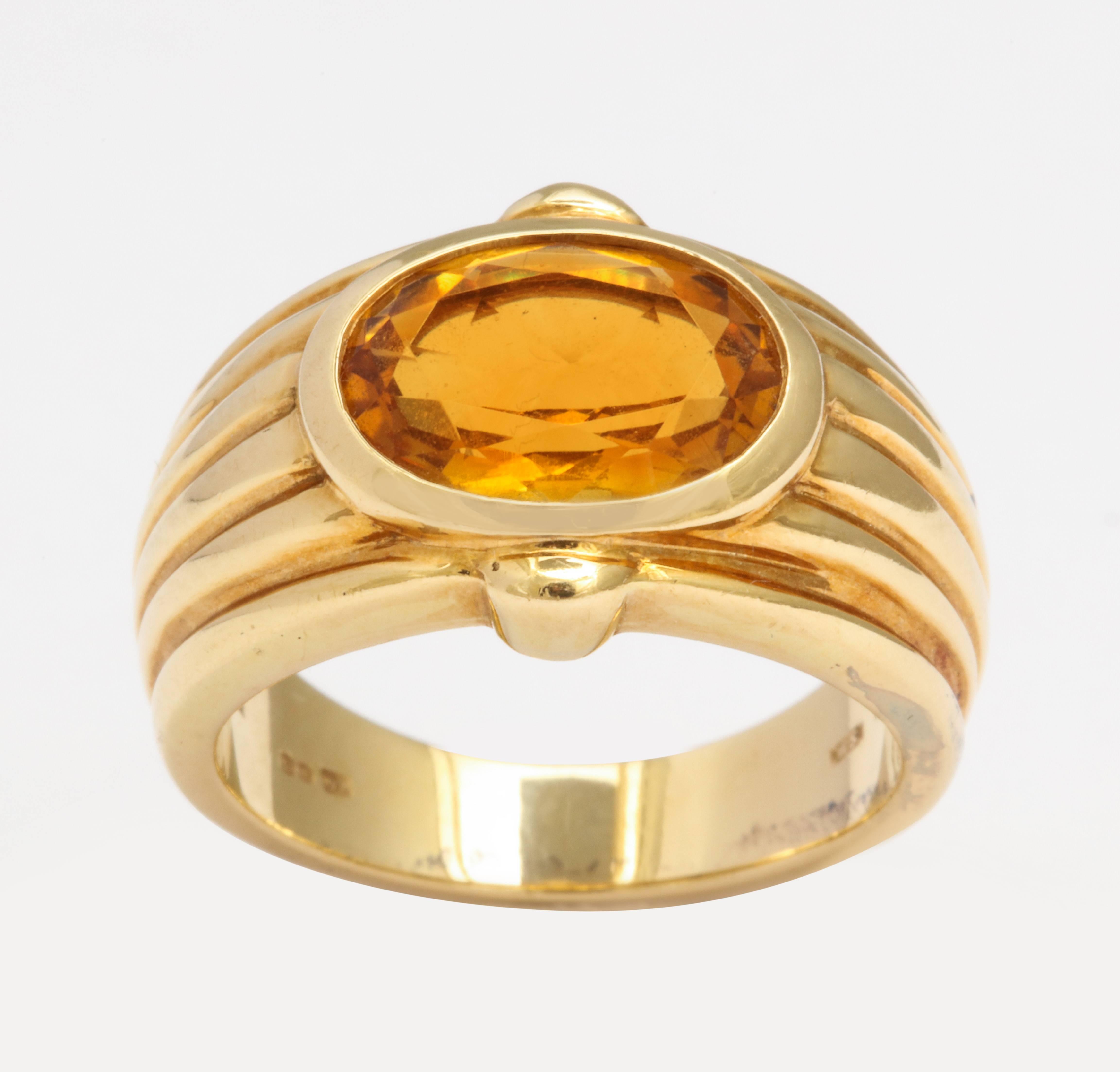 An 18 karat yellow gold ring set with an oval citrine weighing approximately 3.66 carats. Signed Bulgari with Italian makers marks. Ring size 6. 
