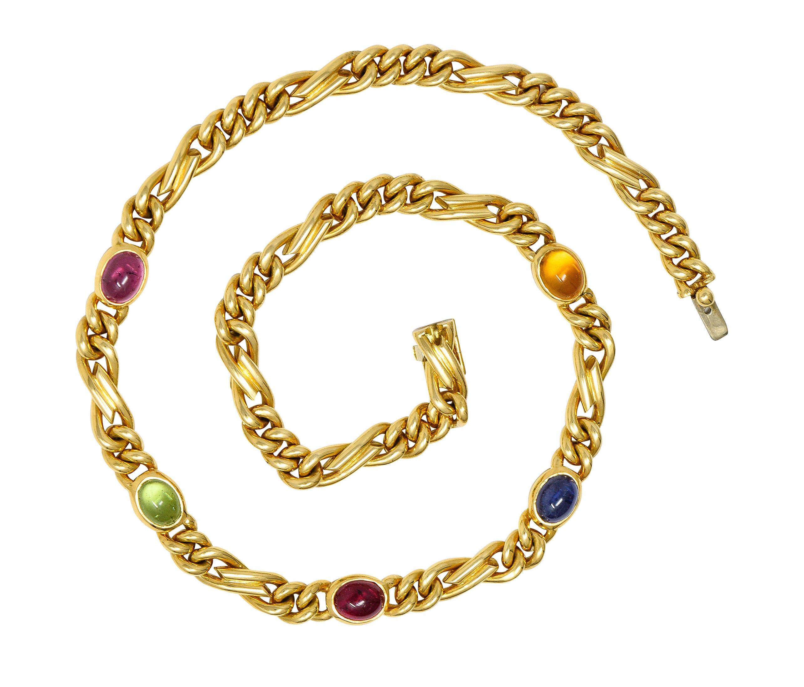 Designed as a figaro style link chain with oval shaped multi-gem cabochons measuring 6.0 x 8.0 mm. Consisting of pink tourmaline, green tourmaline, sapphire, and citrine - bezel set. Transparent medium pink, light green, medium blue, and light
