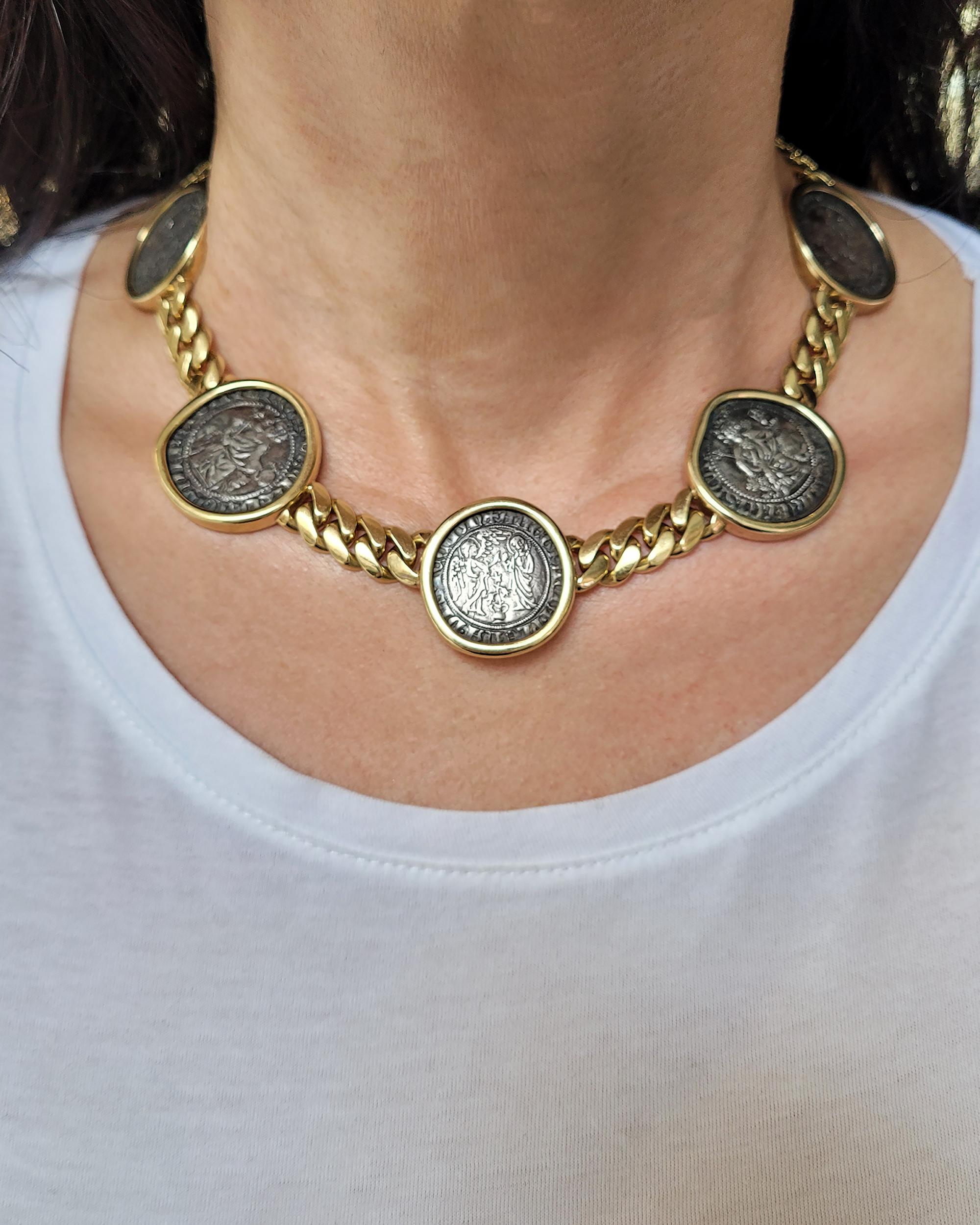 An iconic necklace comprising of 5 ancient Roman coins from the Bulgari's 'Monete' collection.
Metal is 18k yellow gold.
Weight of the necklace is 145.27 grams.
15.5 inches long.
Stamped Bulgari Italy. 
Circa 1980.