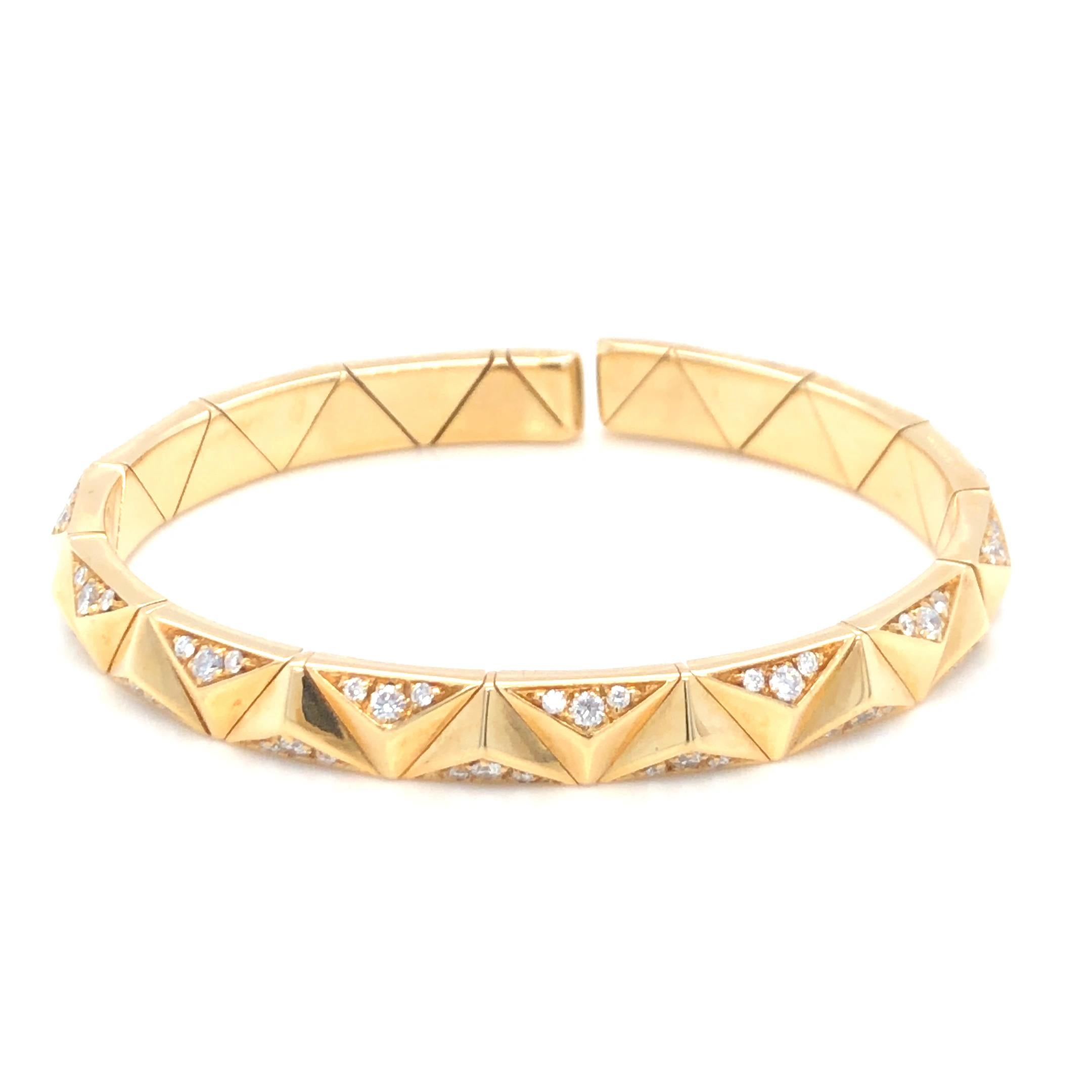 Estate Bulgari Contemporary Diamond Bracelet in 18K Yellow Gold. The bracelet features approximately 0.85ctw of brilliant round cut diamonds. Flexible open bangle. 
6