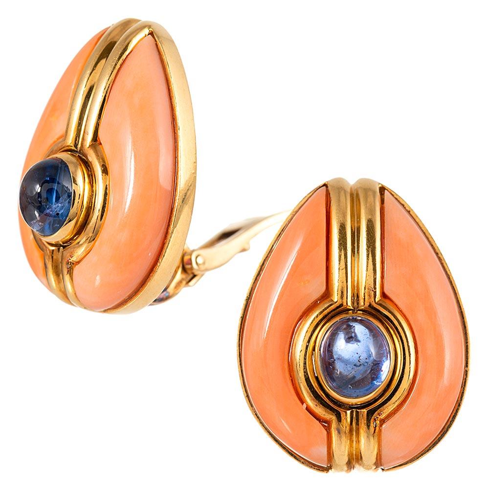 Cabochons of cornflower blue sapphire are set in high polished strokes of golden architecture and bookended by coral frames. These earrings are soft, feminine and entirely sophisticated. The absence of diamonds allows for casual or formal wear. 1