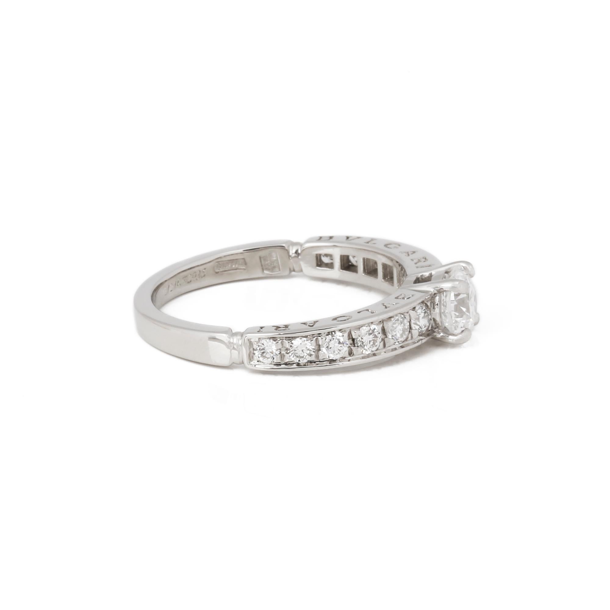 This ring by Bulgari is from the Dedicata a Venezia collection and features a GIA certified 0.5ct diamond complemented by pave set diamonds on the shoulders, mounted in platinum. UK ring size L 1/2. US ring size 52. US ring size 6 1/2. Accompanied